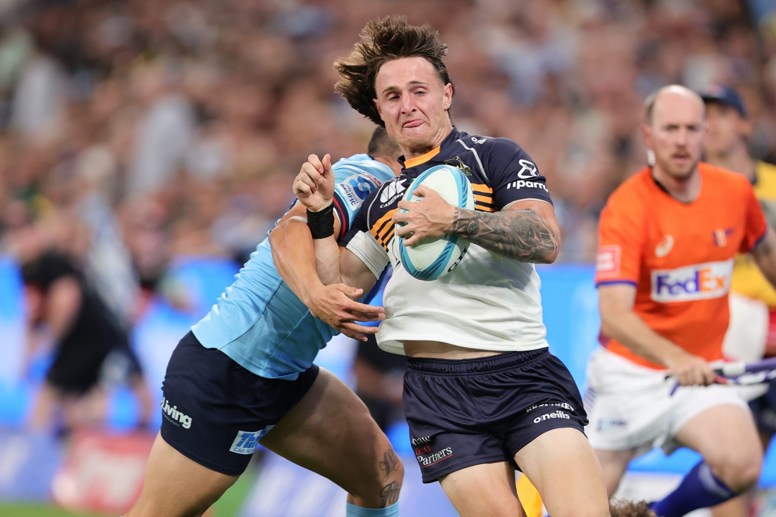Corey Toole of the Brumbies runs the ball.