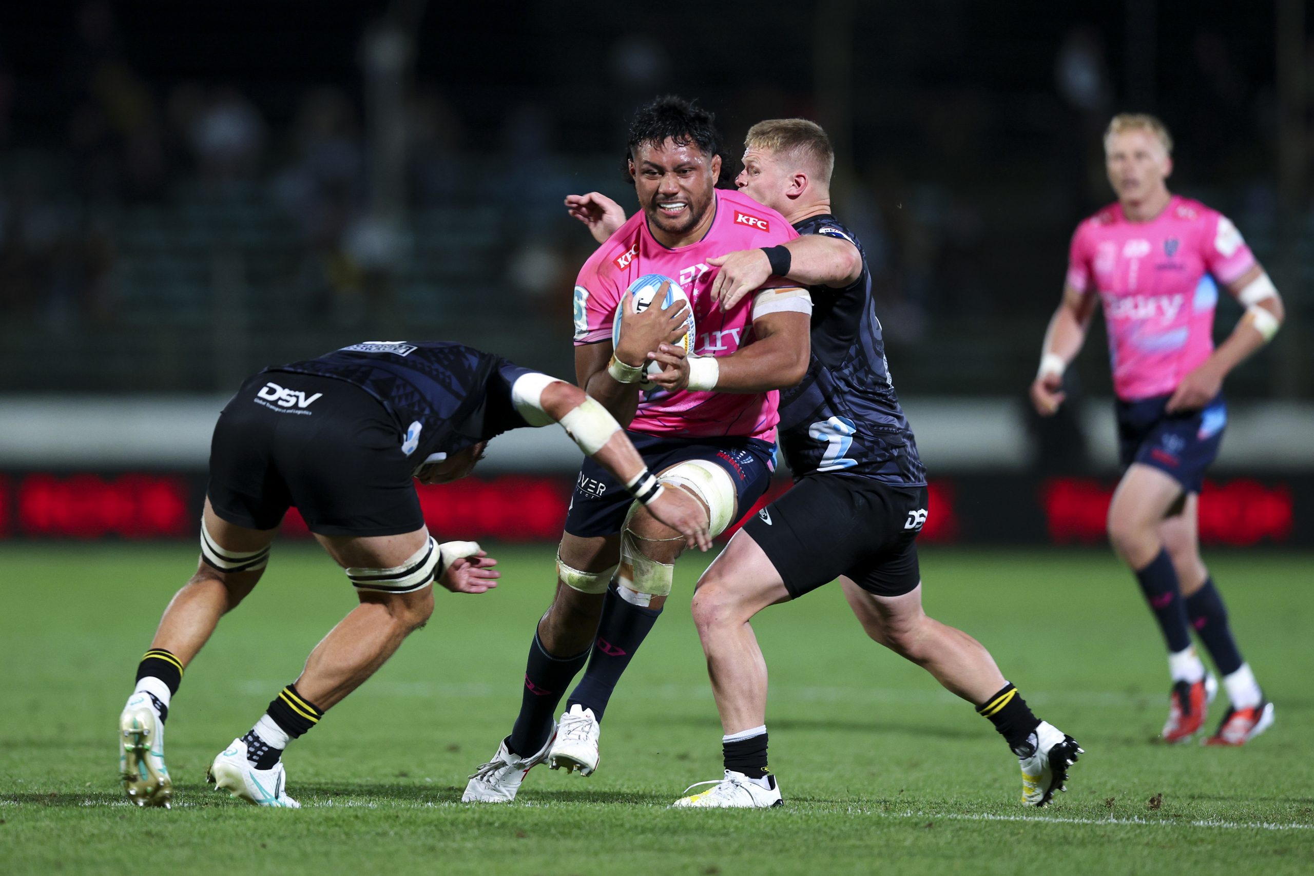Rob Leota of the Rebels is tackled during the round five Super Rugby Pacific match between Hurricanes and Melbourne Rebels.