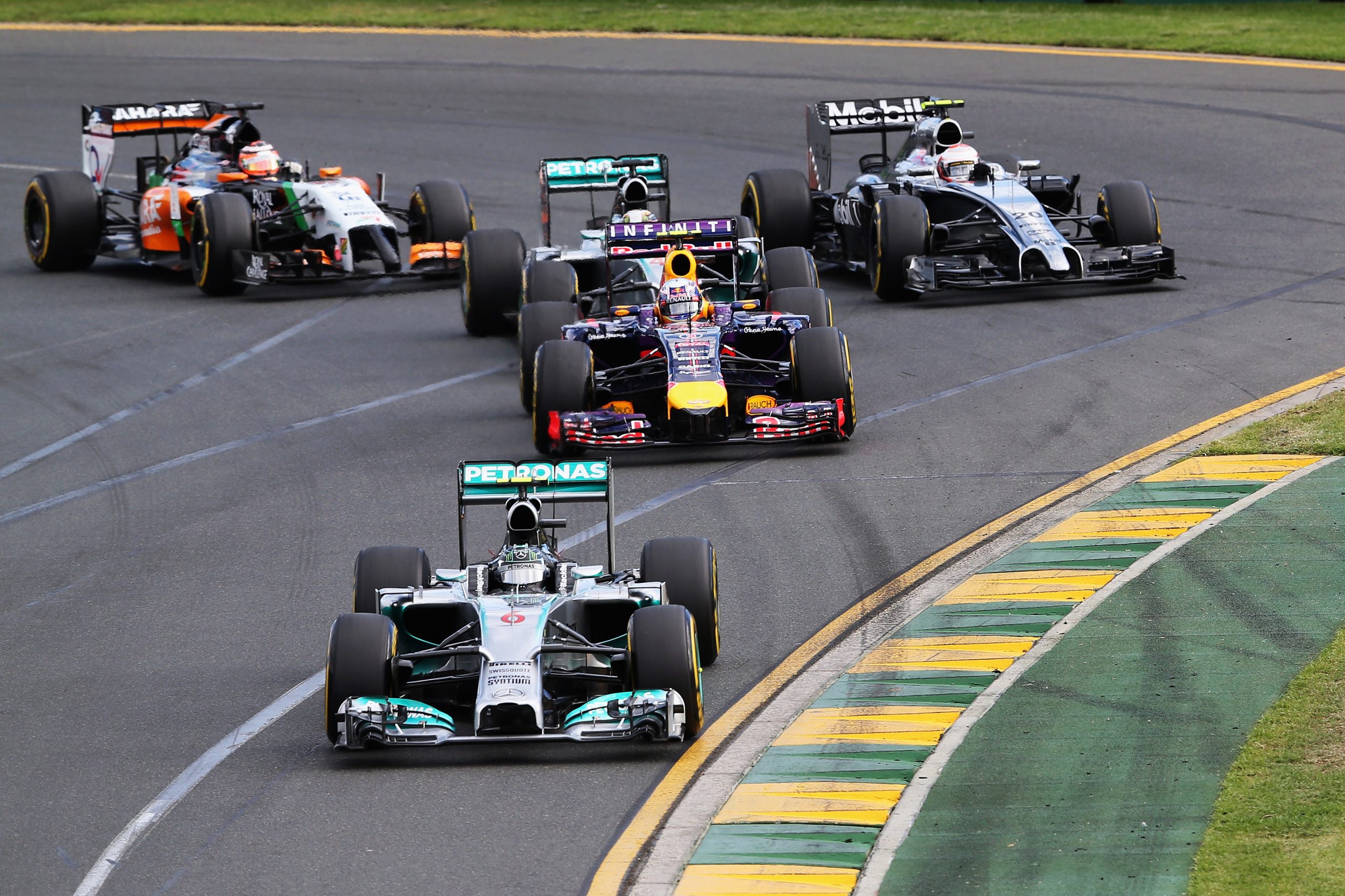 Mercedes' Nico Rosberg leads Daniel Ricciardo into turn one in the 2014 Australian Grand Prix.