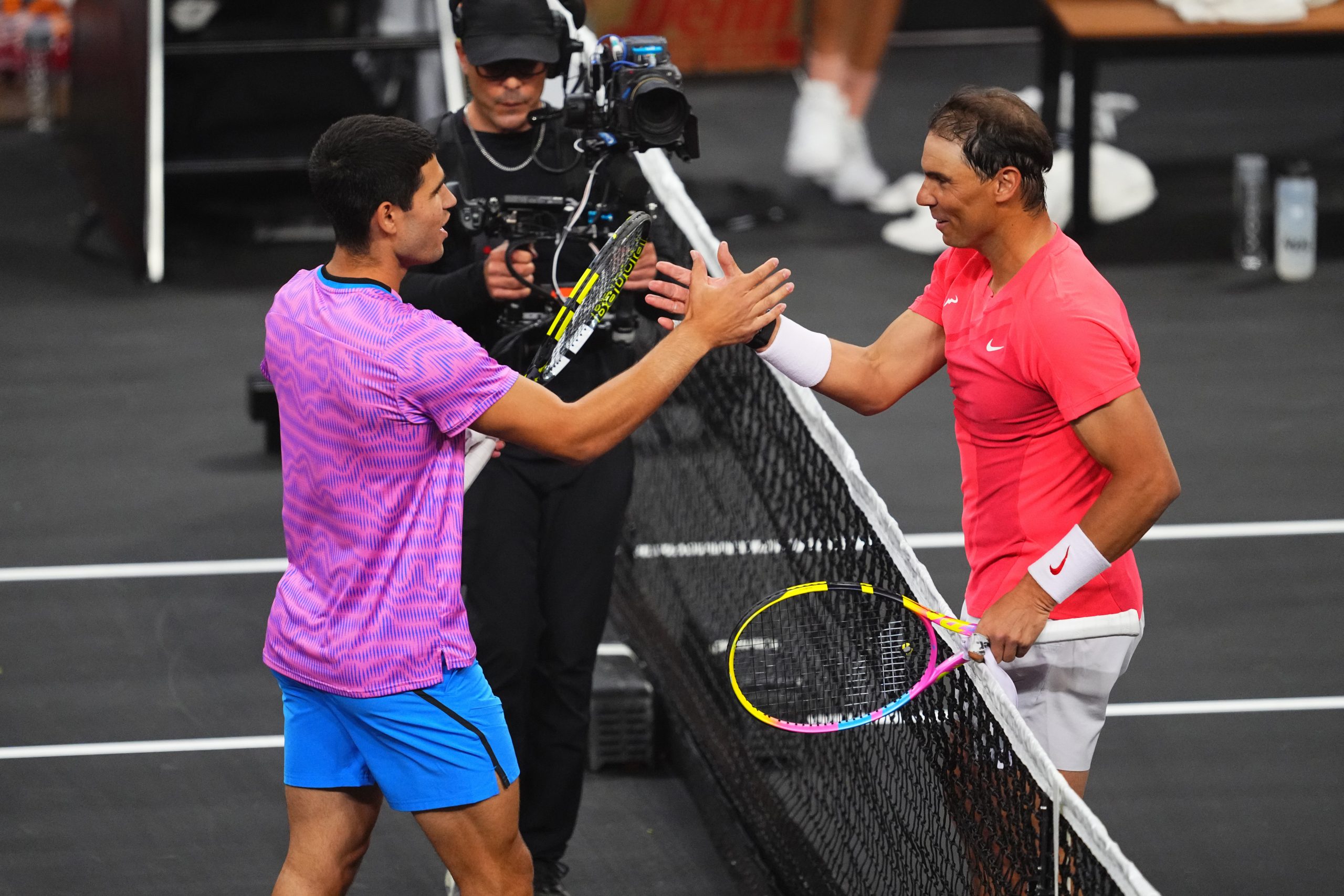 Carlos Alcaraz and Rafael Nadal at the net at the end of The Netflix Slam at Mandalay Bay Resort and Casino on March 3, 2024 in Las Vegas, Nevada. (Photo by Chris Unger)