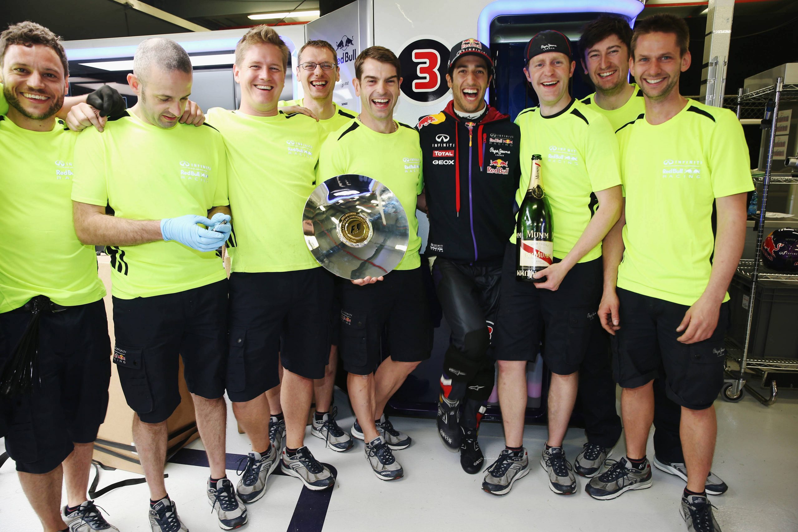 Daniel Ricciardo and the Red Bull Racing team celebrate in the garage after finishing second at his home grand prix.