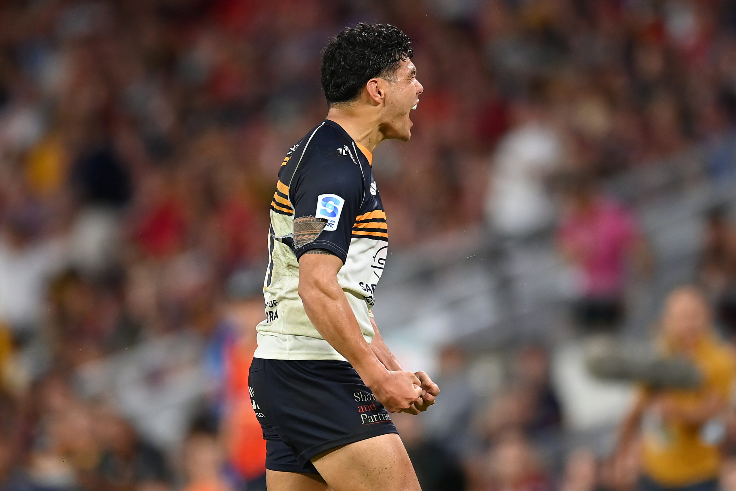 Noah Lolesio of the Brumbies celebrates the victory.