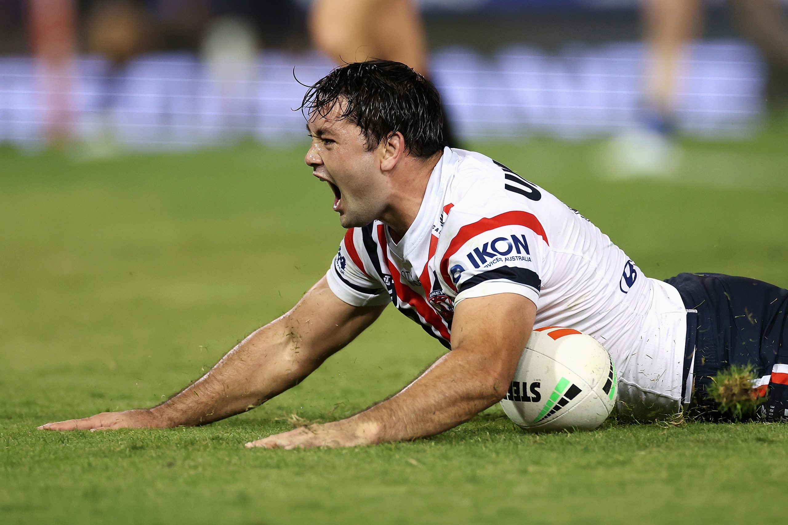 Brandon Smith of the Roosters scores a try during the round six NRL match against the Knights.
