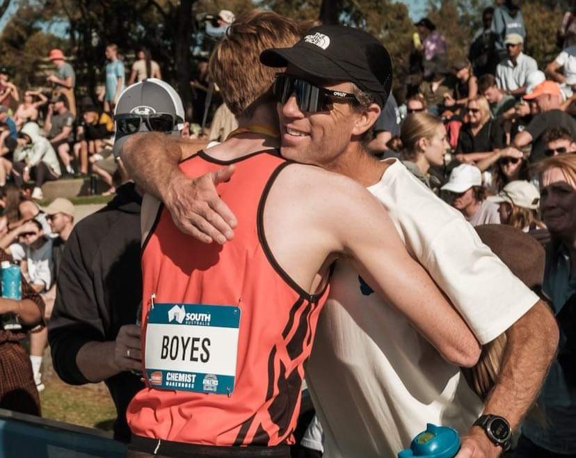 Luke Boyes sharing an emotional embrace with Ben St Lawrence.