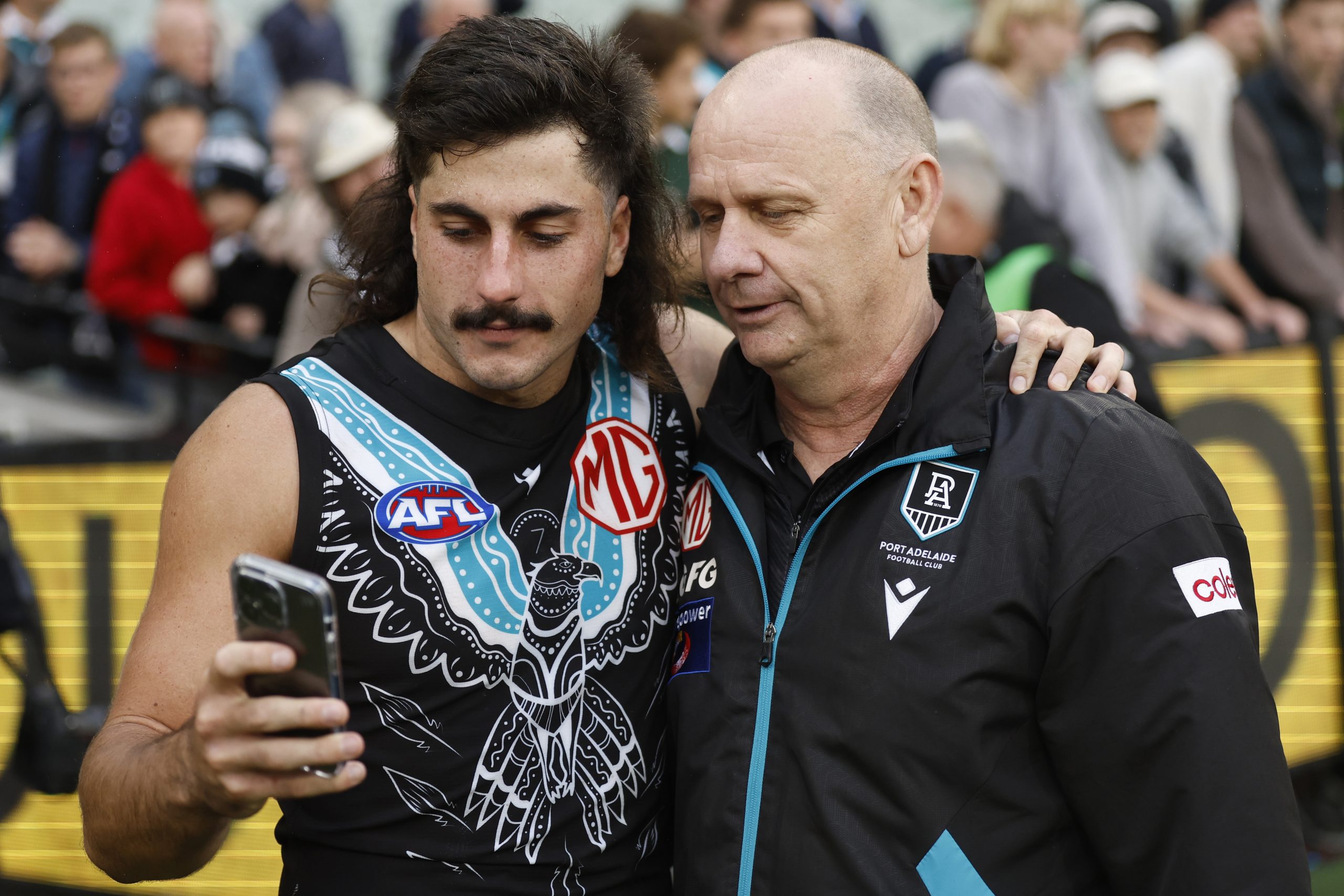 Lachie Jones with coach Ken Hinkley.