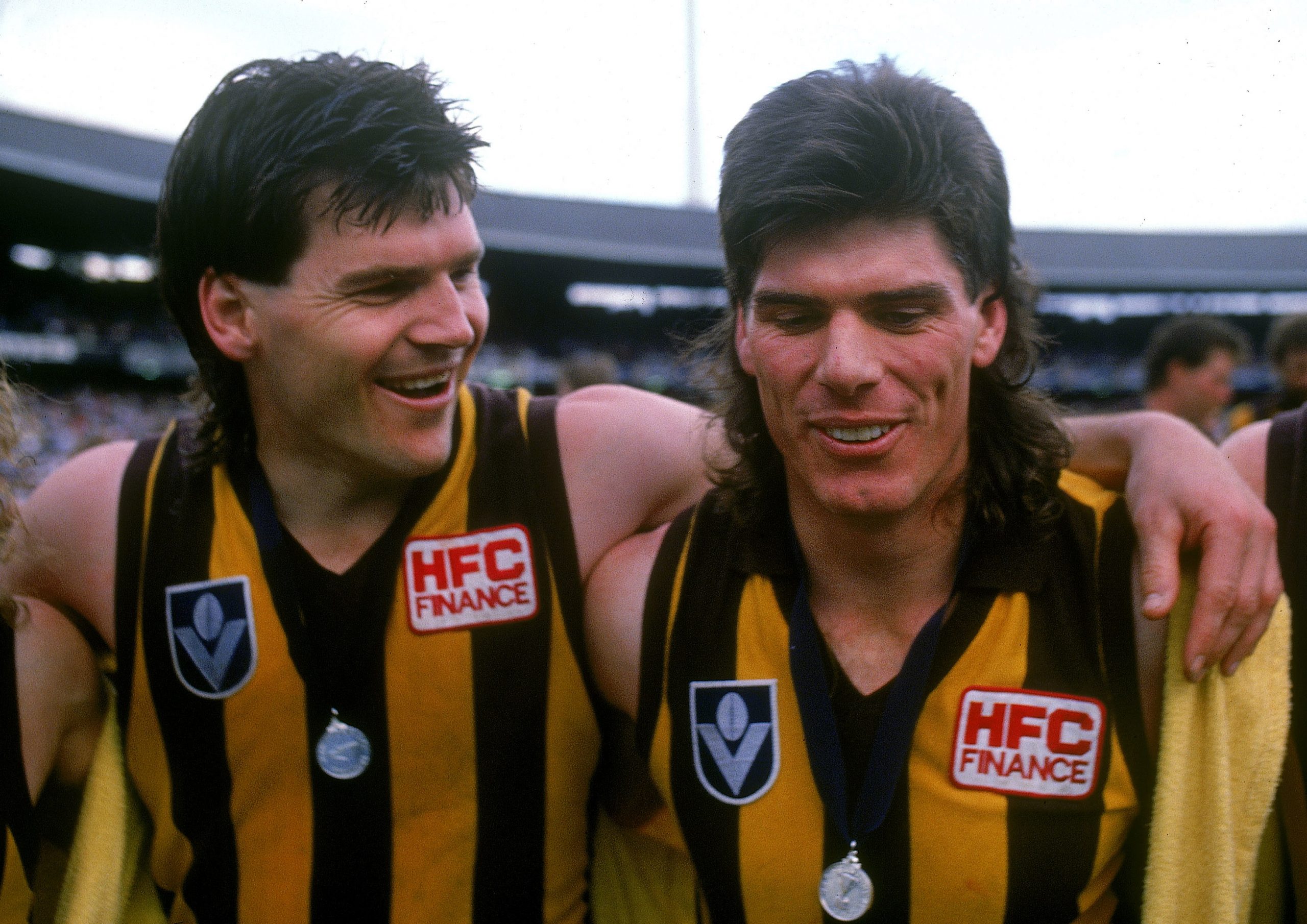 Jason Dunstall and Gary Ayres of the Hawks celebrate after winning the 1989 AFL grand final against the Cats.