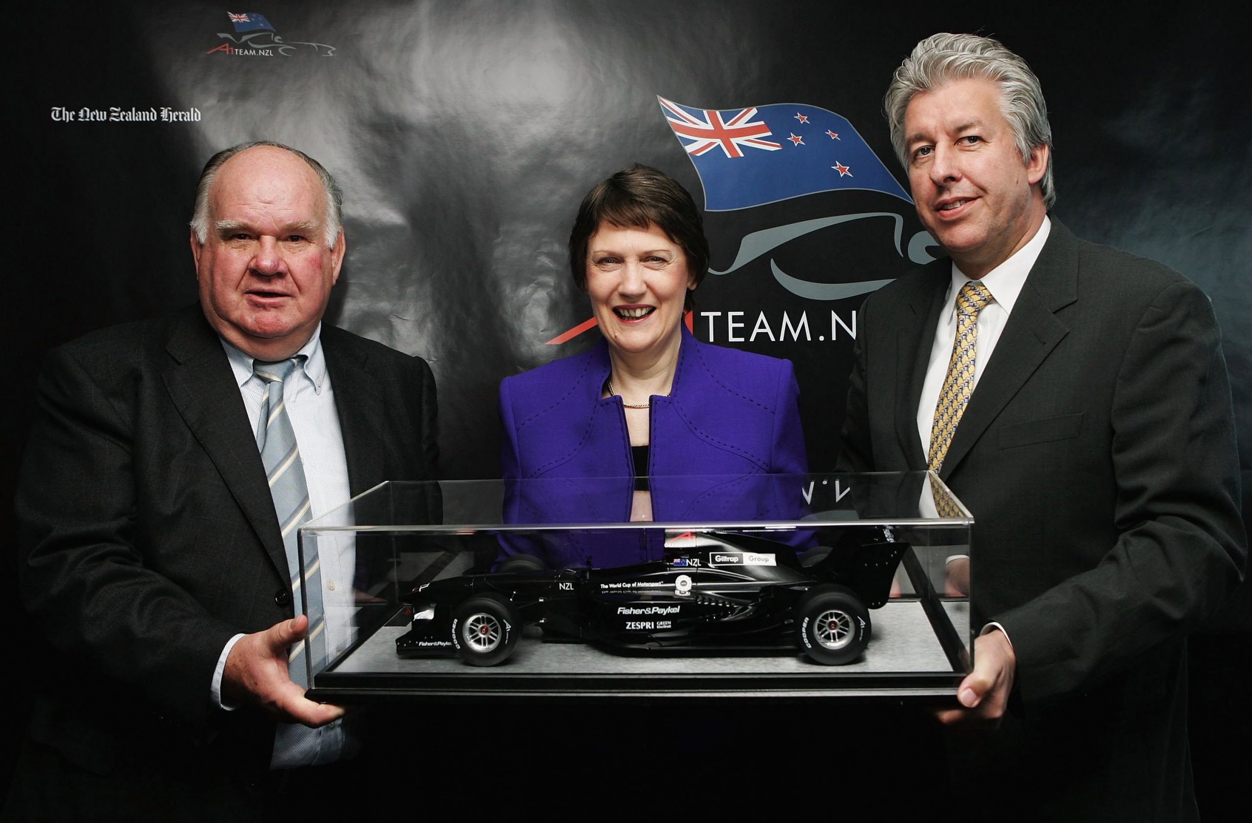 Colin Giltrap (left) with the then-Prime Minister Helen Clark and A1GP chief operating officer David Clare pose during a press conference pictured in 2006.