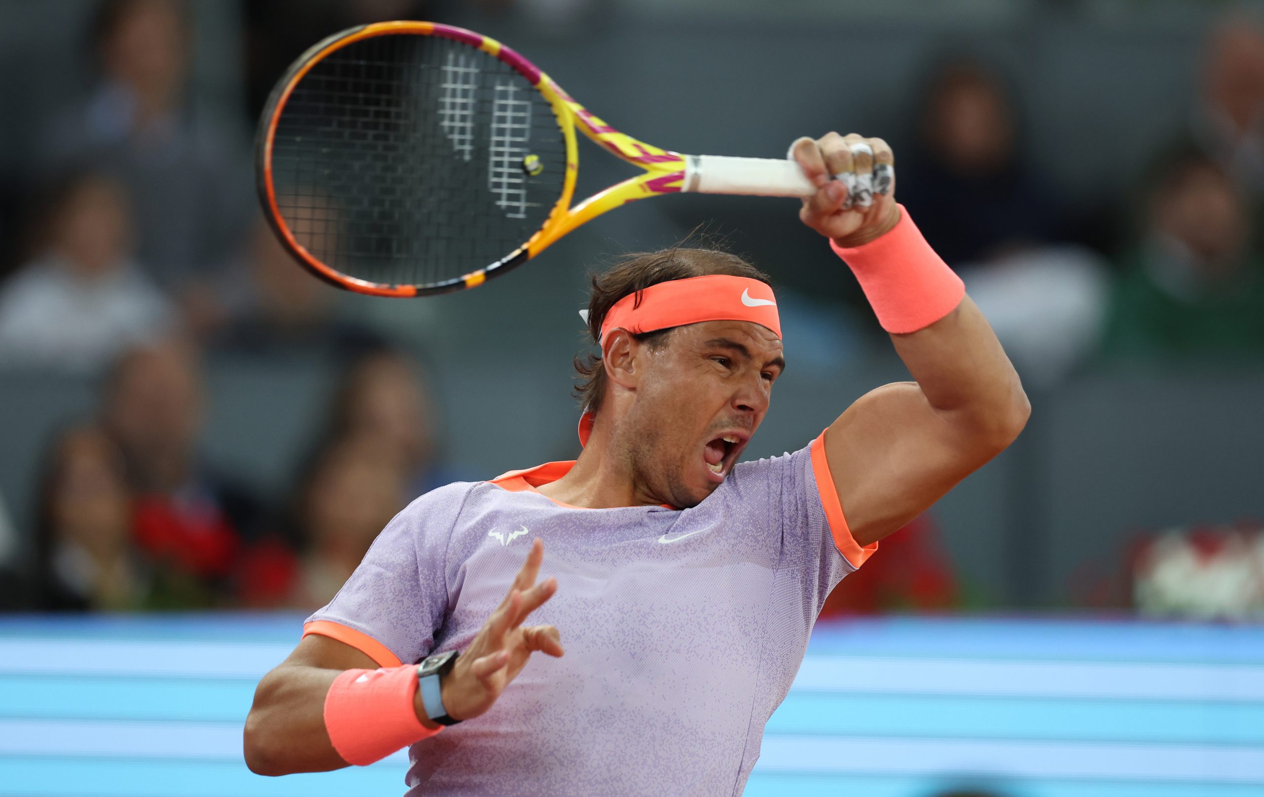Rafael Nadal of Spain plays a forehand against Alex de Minaur of Australia in the Men's Singles Round of 64 match during Day Five of the Mutua Madrid Open at La Caja Magica on April 27, 2024 in Madrid, Spain. (Photo by Clive Brunskill/Getty Images)