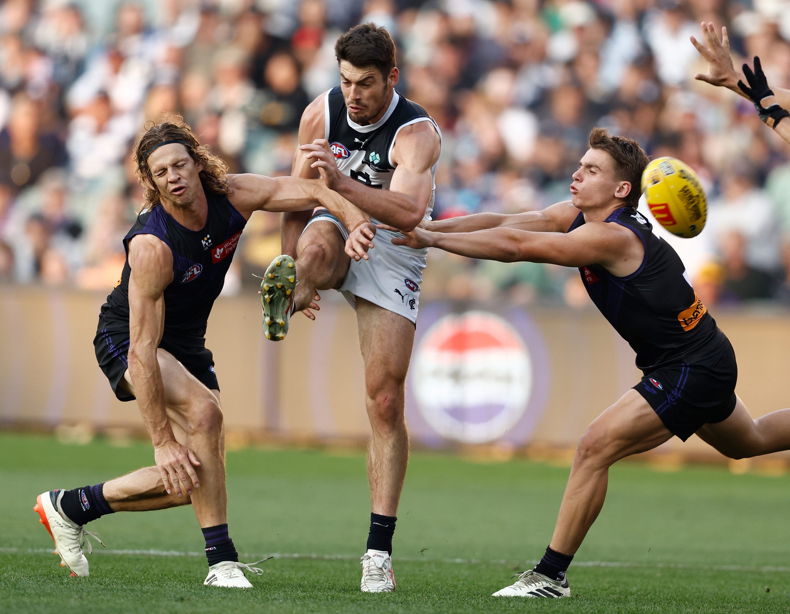 George Hewett kicks the ball.