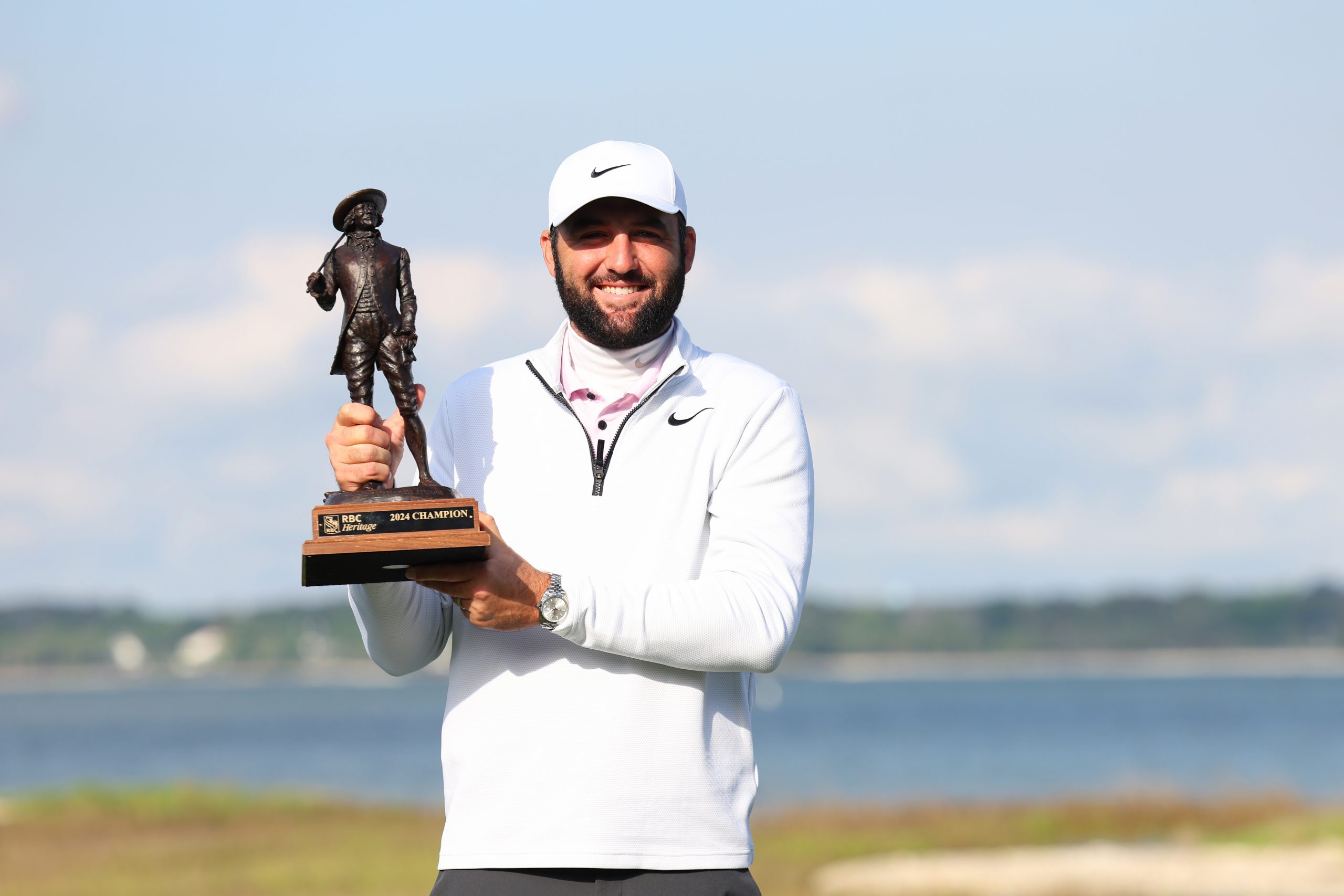 Scottie Scheffler of the United States celebrates with the trophy after winning the RBC Heritage at Harbour Town.