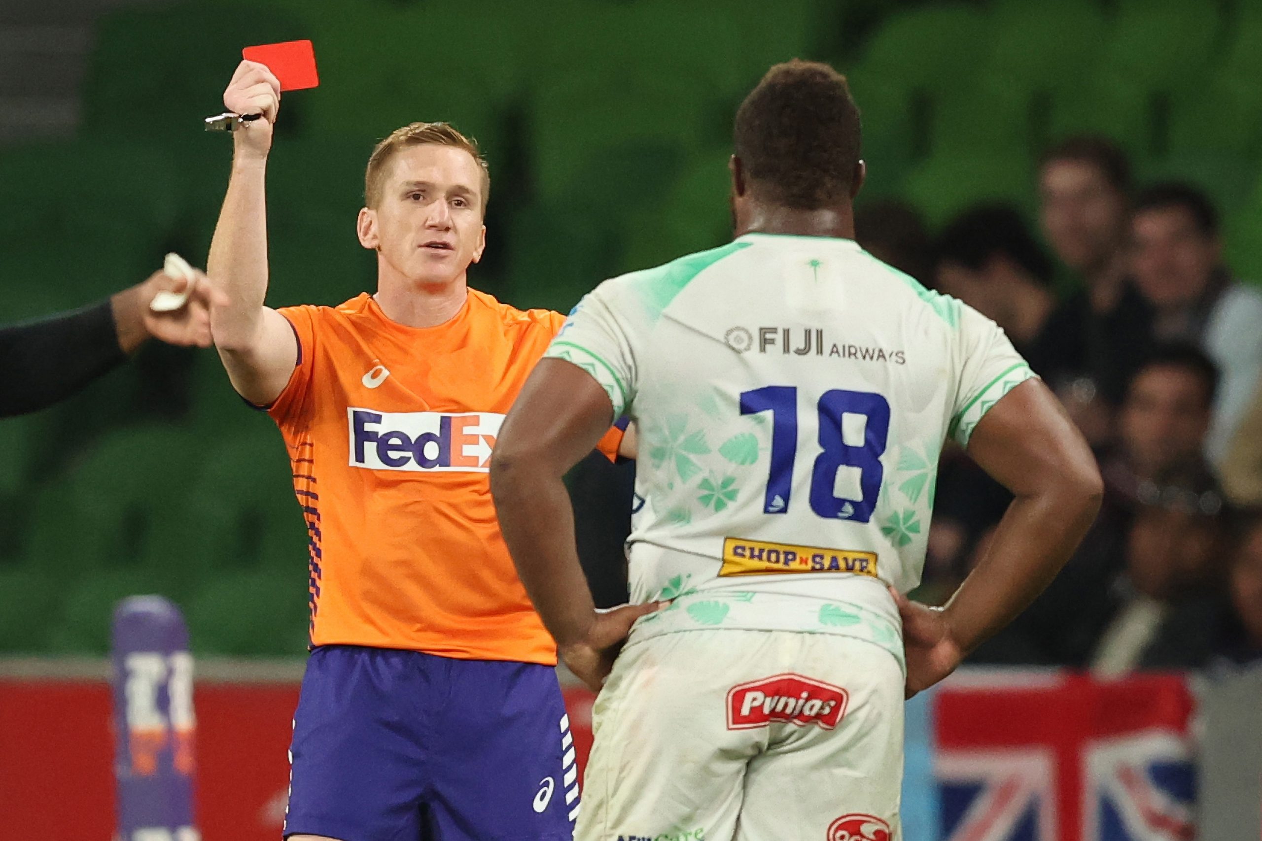 The referee shows the red card to Jone Koroiduadua of Fijian Drua during the round seven Super Rugby Pacific match against the Rebels.