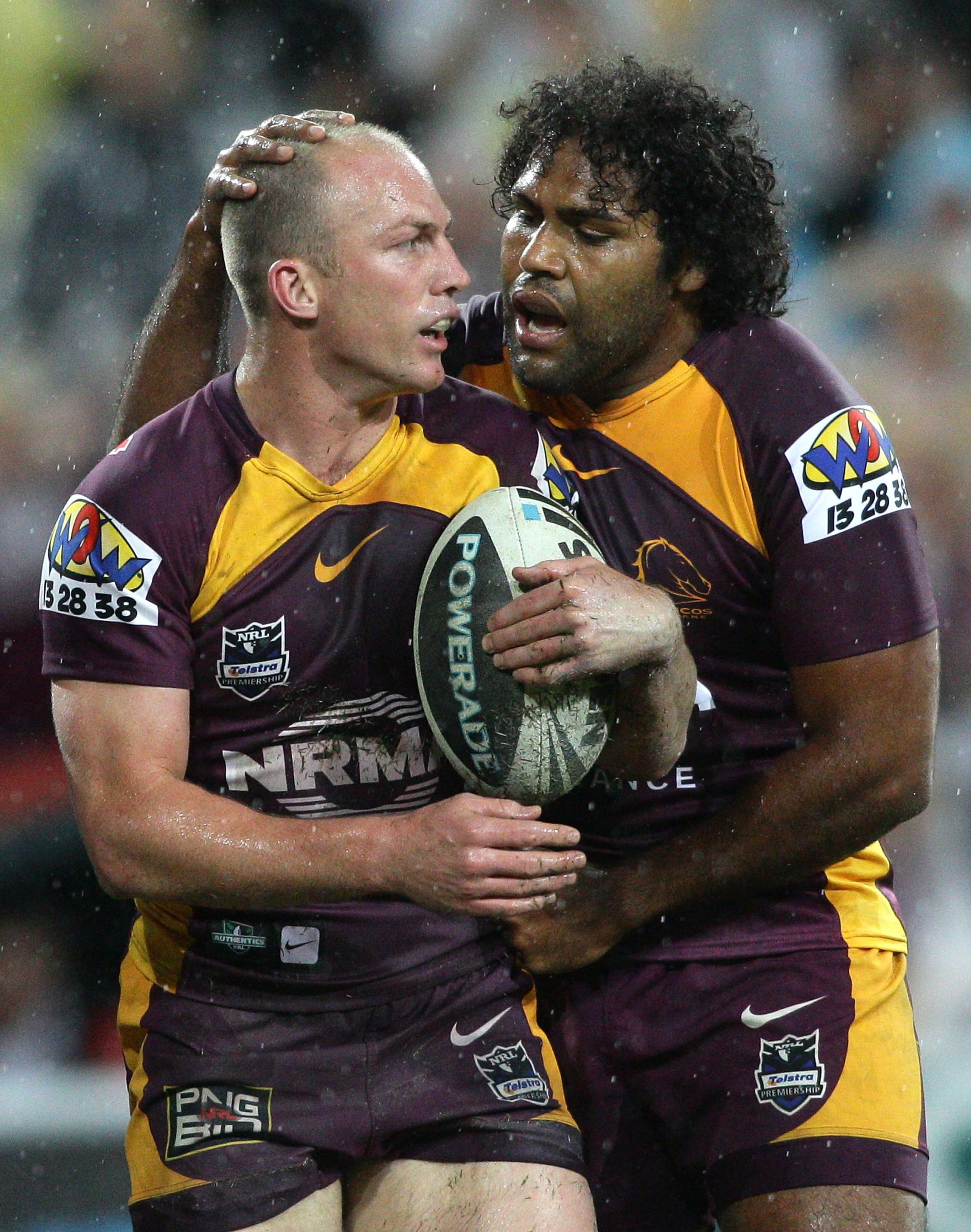 Darren Lockyer (left) with Sam Thaiday (Right) during match between the Brisbane Broncos and the Caterbury Bulldogs in 2011. (Getty Images).