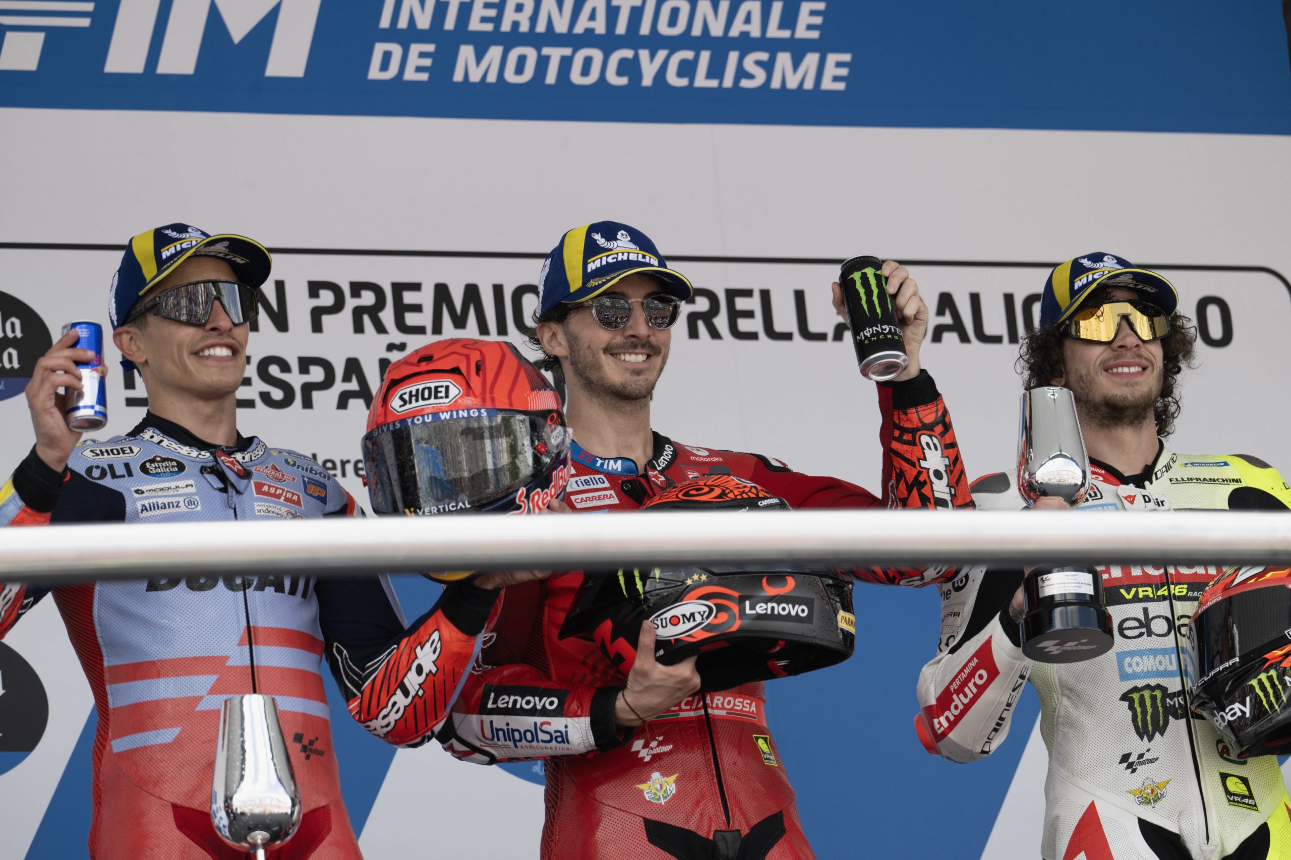 Marc Marquez, Francesco Bagnaia and  Marco Bezzecchi celebrate on the podium at the end of the 2024 Spanish MotoGP.