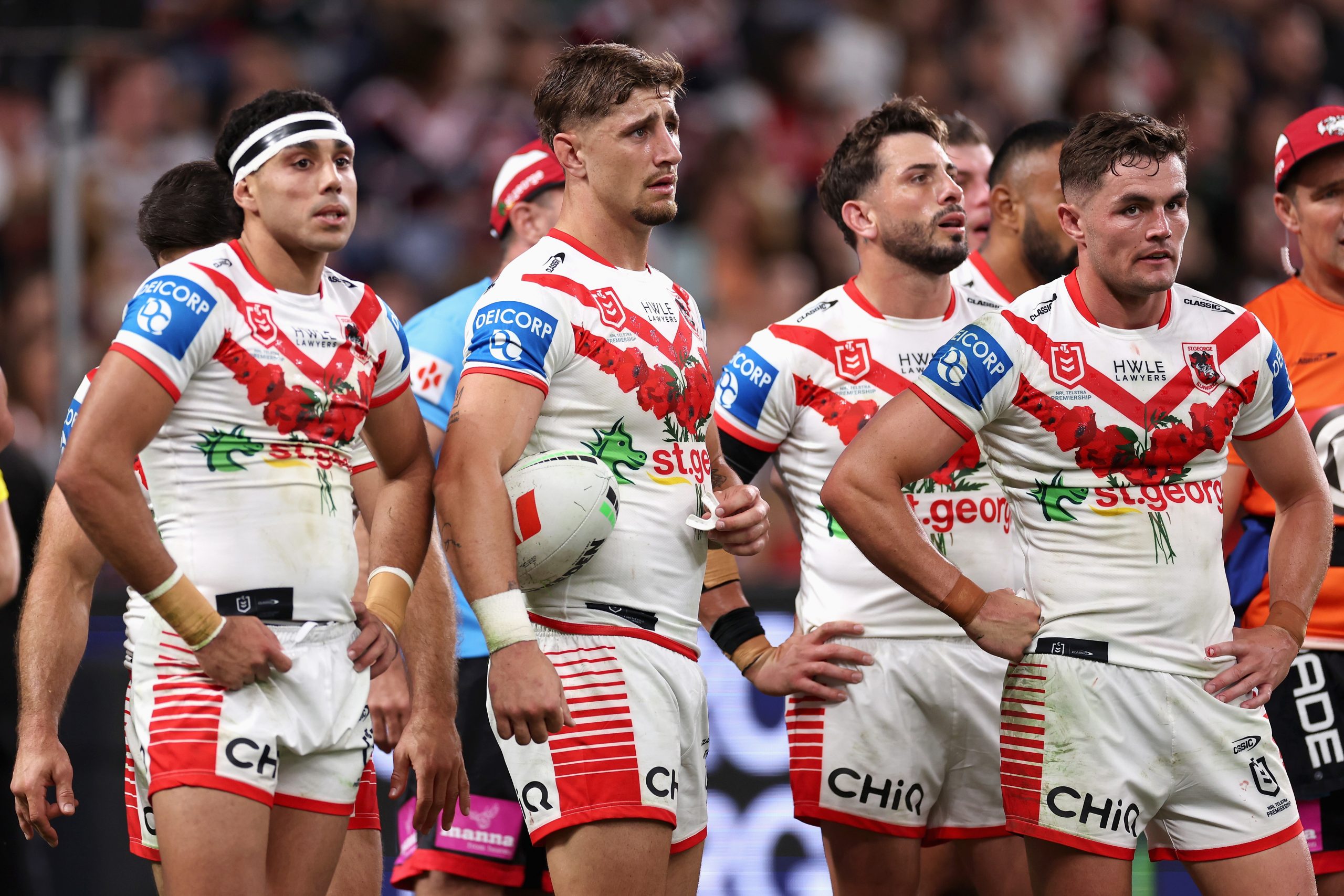 Dragons players look dejected during the loss to the Roosters.