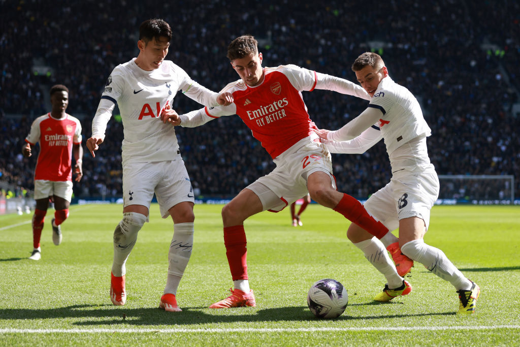 The North London derby: Tottenham Hotspur players defending an Arsenal player. 