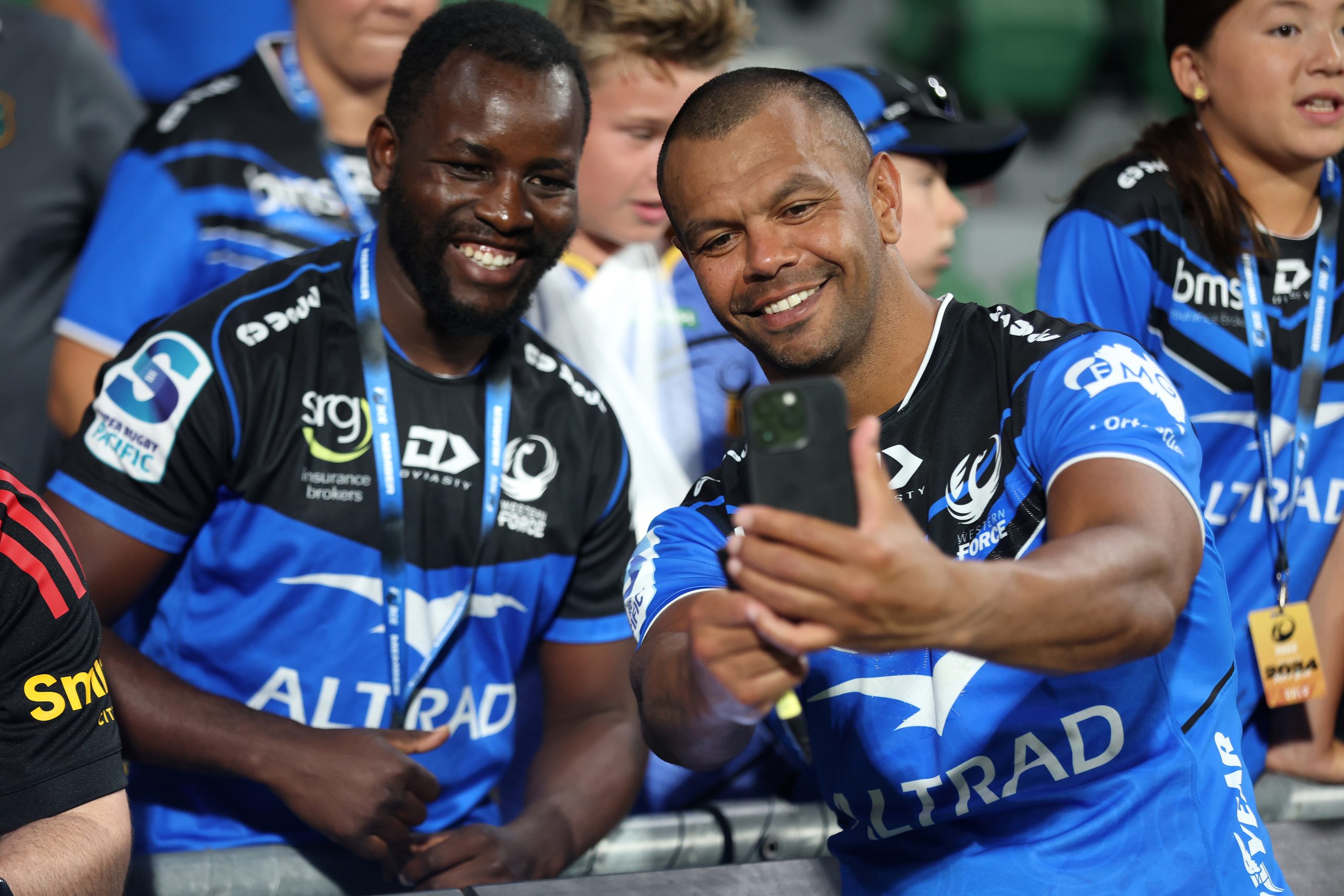 Kurtley Beale of the Force poses for a selfie with a fan after winning.