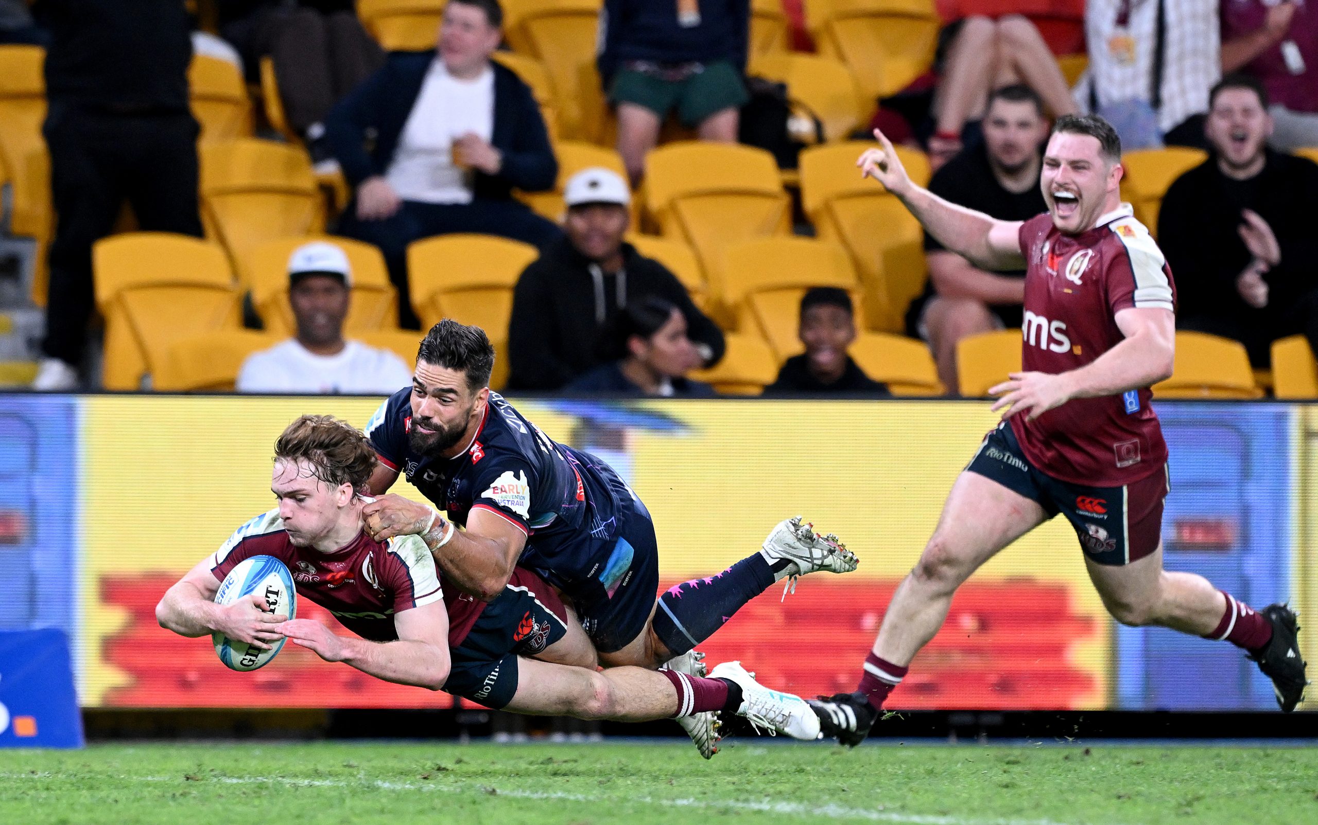 Tim Ryan of the Reds scores a try during the round 12 Super Rugby Pacific match between Queensland Reds and Melbourne Rebels.