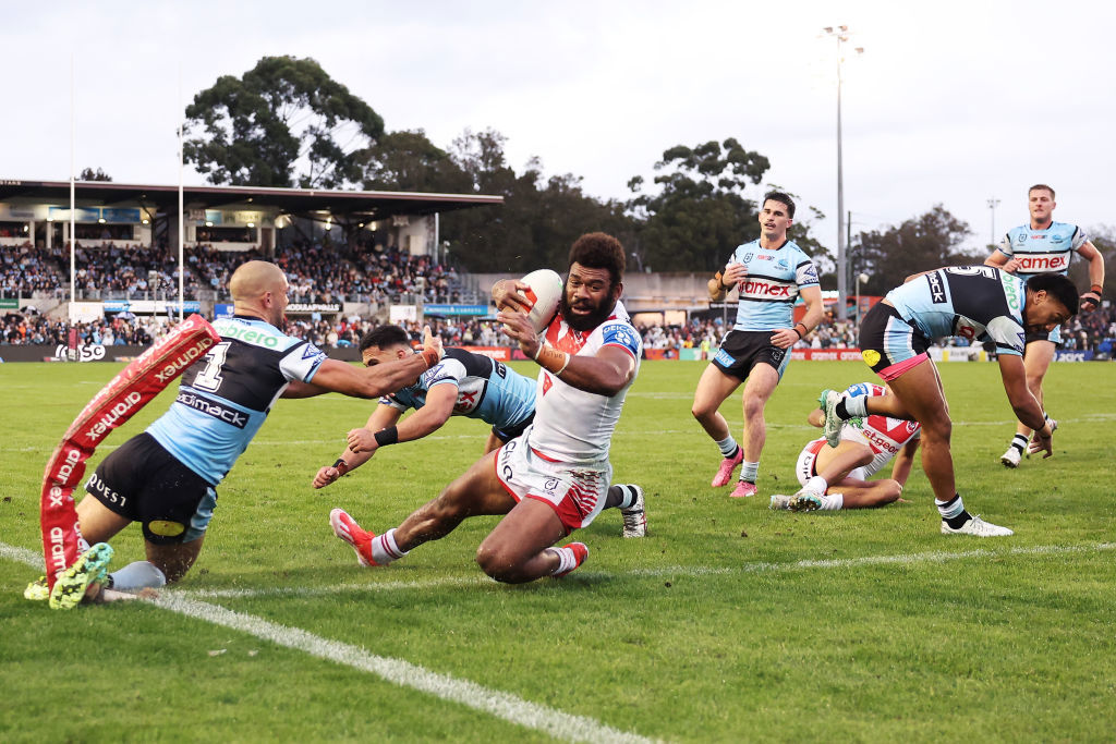 Dragons star Mikaele Ravalawa scores.