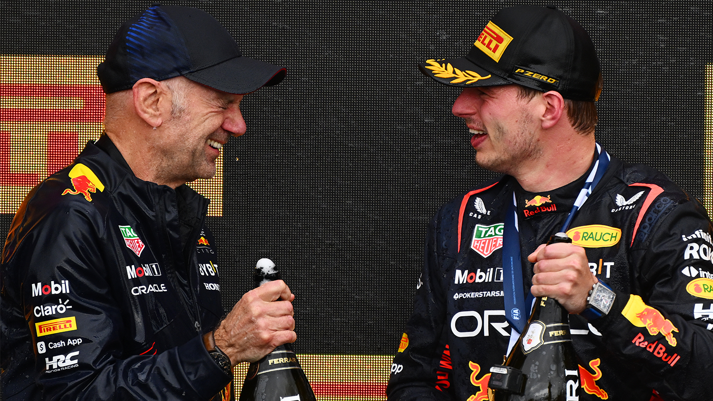 Adrian Newey and Max Verstappen celebrate on the podium following the 2023 Canadian Grand Prix.
