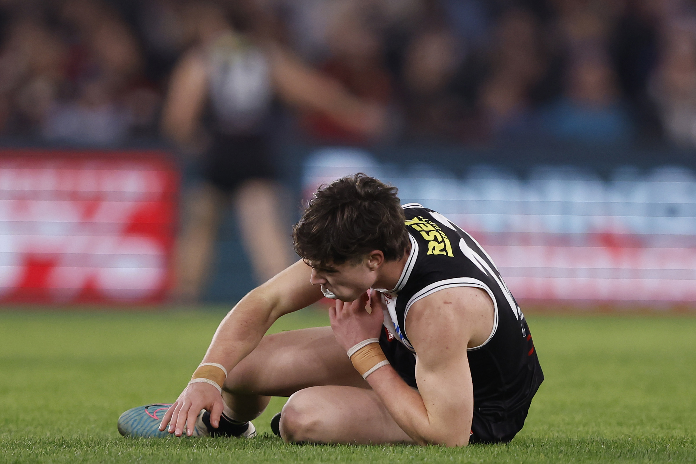 Darcy Wilson stayed on the ground after colliding with Wardlaw.