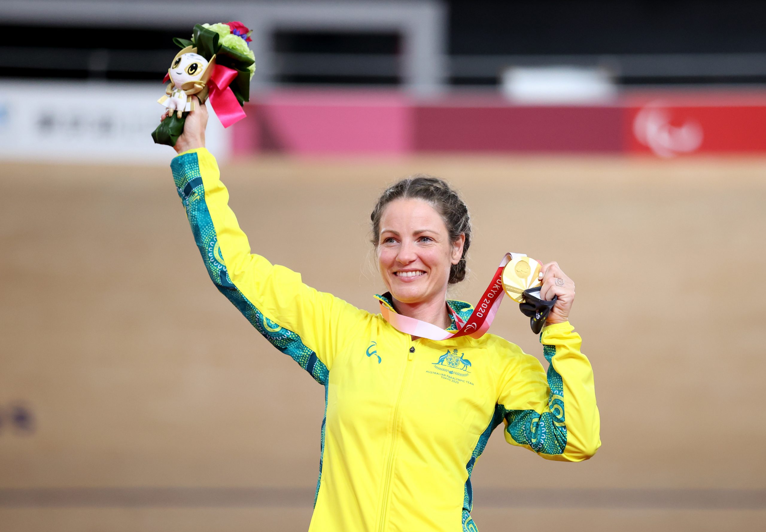 Emily Petricola celebrates winning gold at Tokyo 2020.