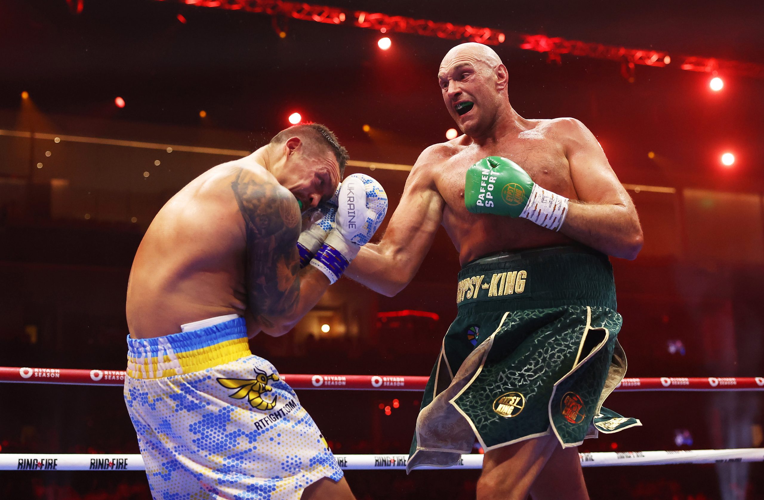 Tyson Fury punches Oleksandr Usyk during the IBF, WBA, WBC, WBO and Undisputed Heavyweight titles' fight between Tyson Fury and Oleksandr Usyk at Kingdom Arena on May 18, 2024 in Riyadh, Saudi Arabia. (Photo by Richard Pelham/Getty Images)