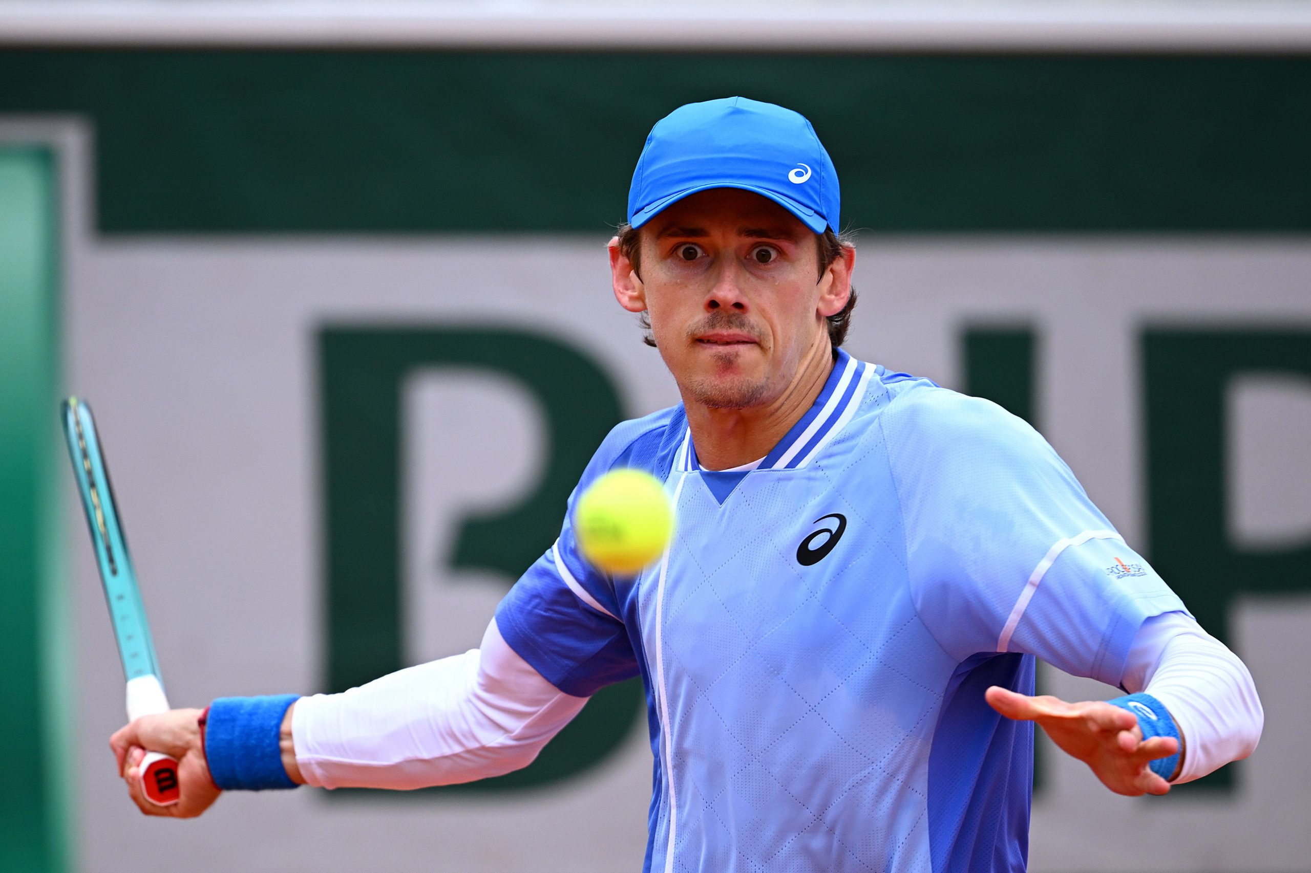 Alex de Minaur of Australia plays a forehand against Alex Michelsen.