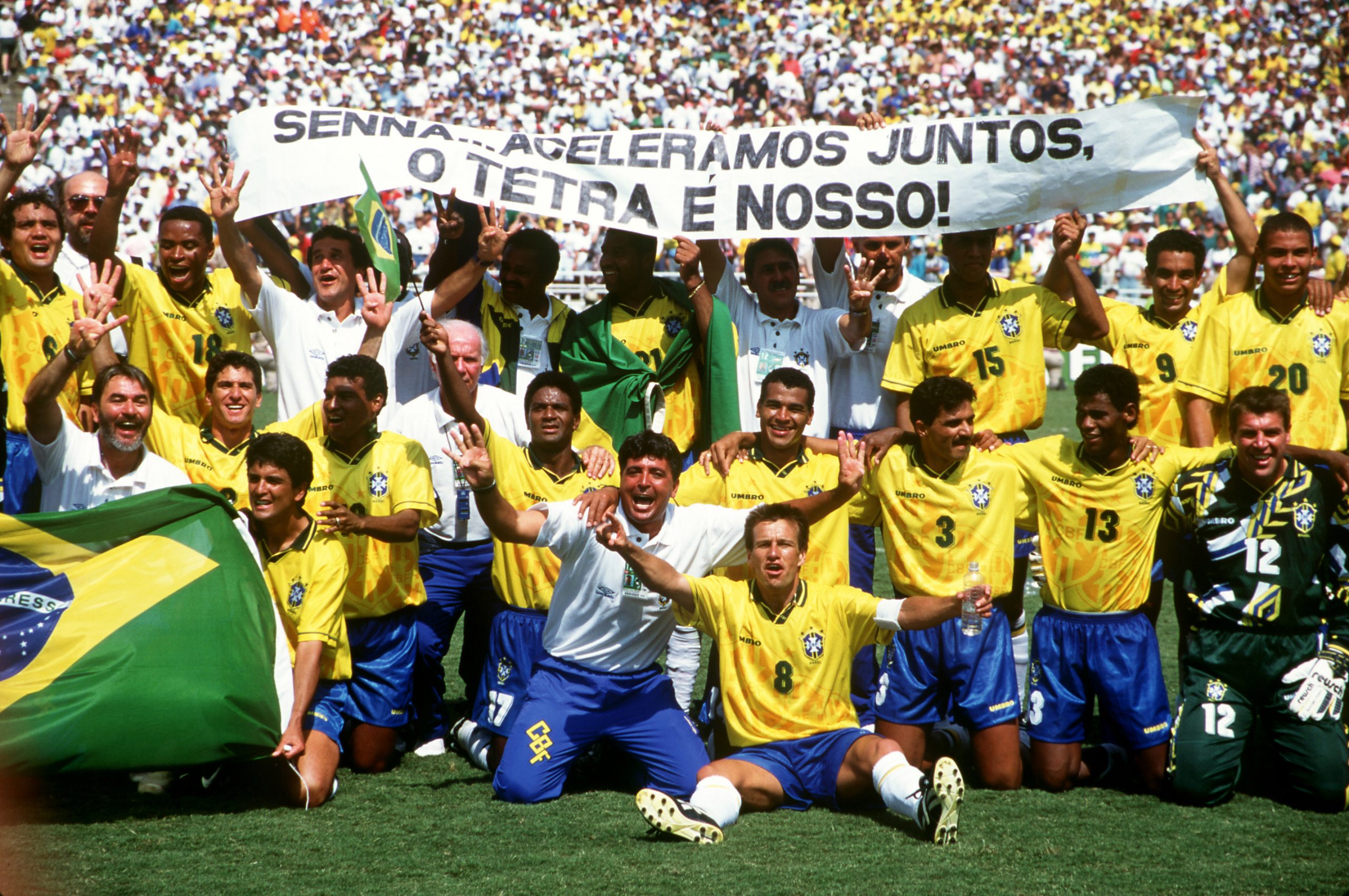 The victorious Brazilian team celebrate winning the final with a banner in memory of the Brazilian Formula One star, Ayrton Senna who was killed in San Marino in May.  (Photo by Peter Robinson/EMPICS via Getty Images)