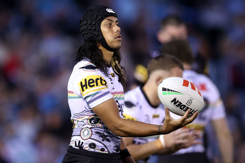 Jarome Luai spins the ball during warmup.