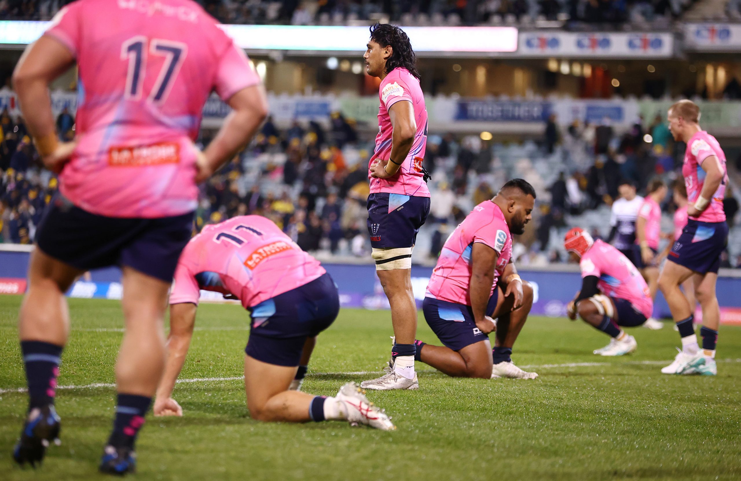 Rebels players look dejected during the round 14 Super Rugby Pacific match between ACT Brumbies and Melbourne Rebels.
