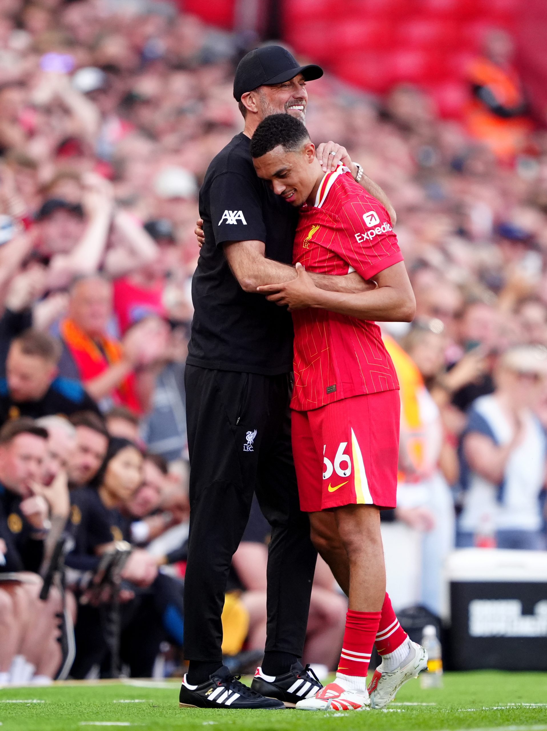 Liverpool's Trent Alexander-Arnold hugs outgoing manager Jurgen Klopp after being substituted during the Premier League match at Anfield.