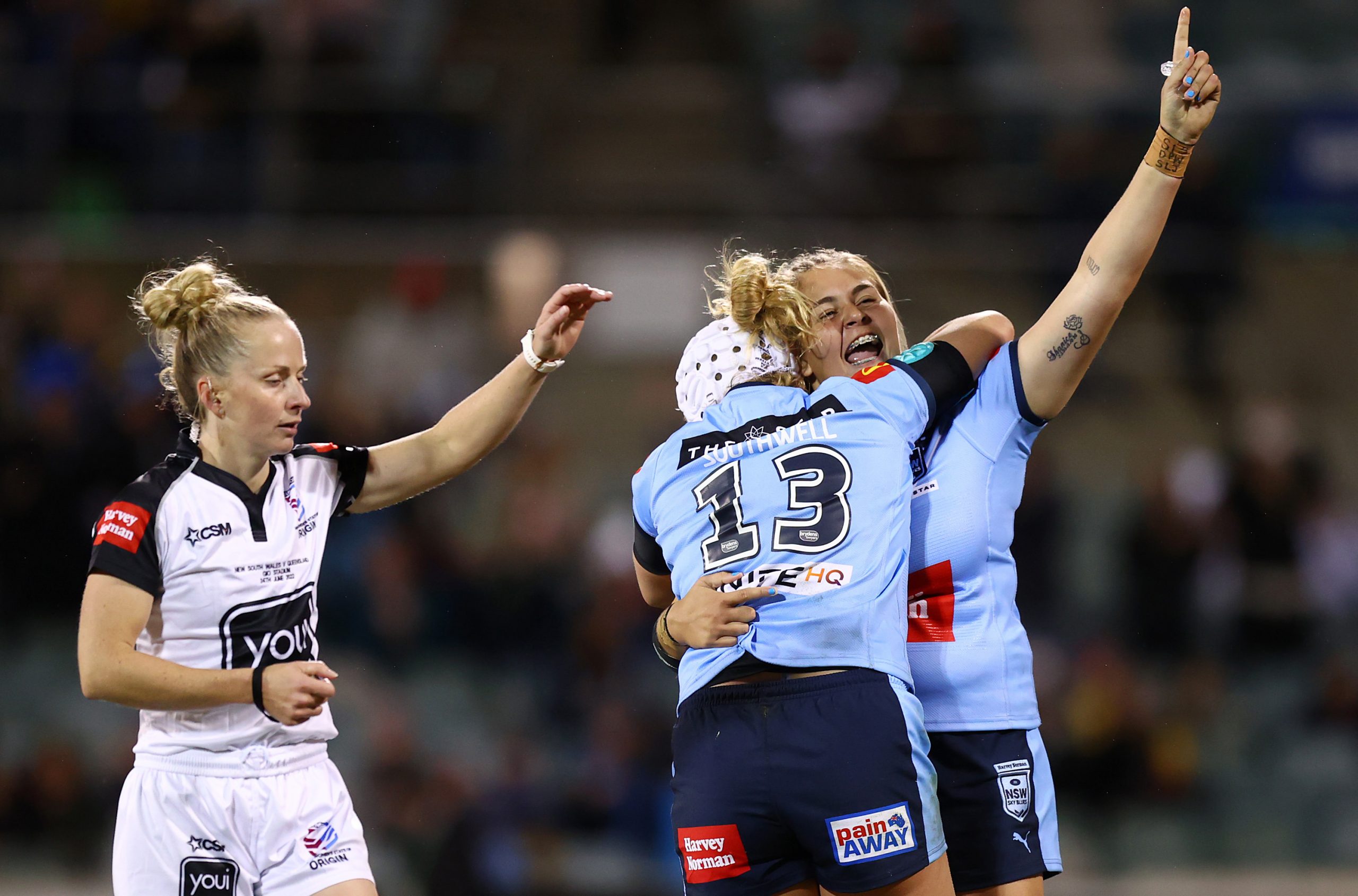 Caitlan Johnston and Hannah Southwell of the Blues celebrate winning the 2022 Women's State of Origin match.