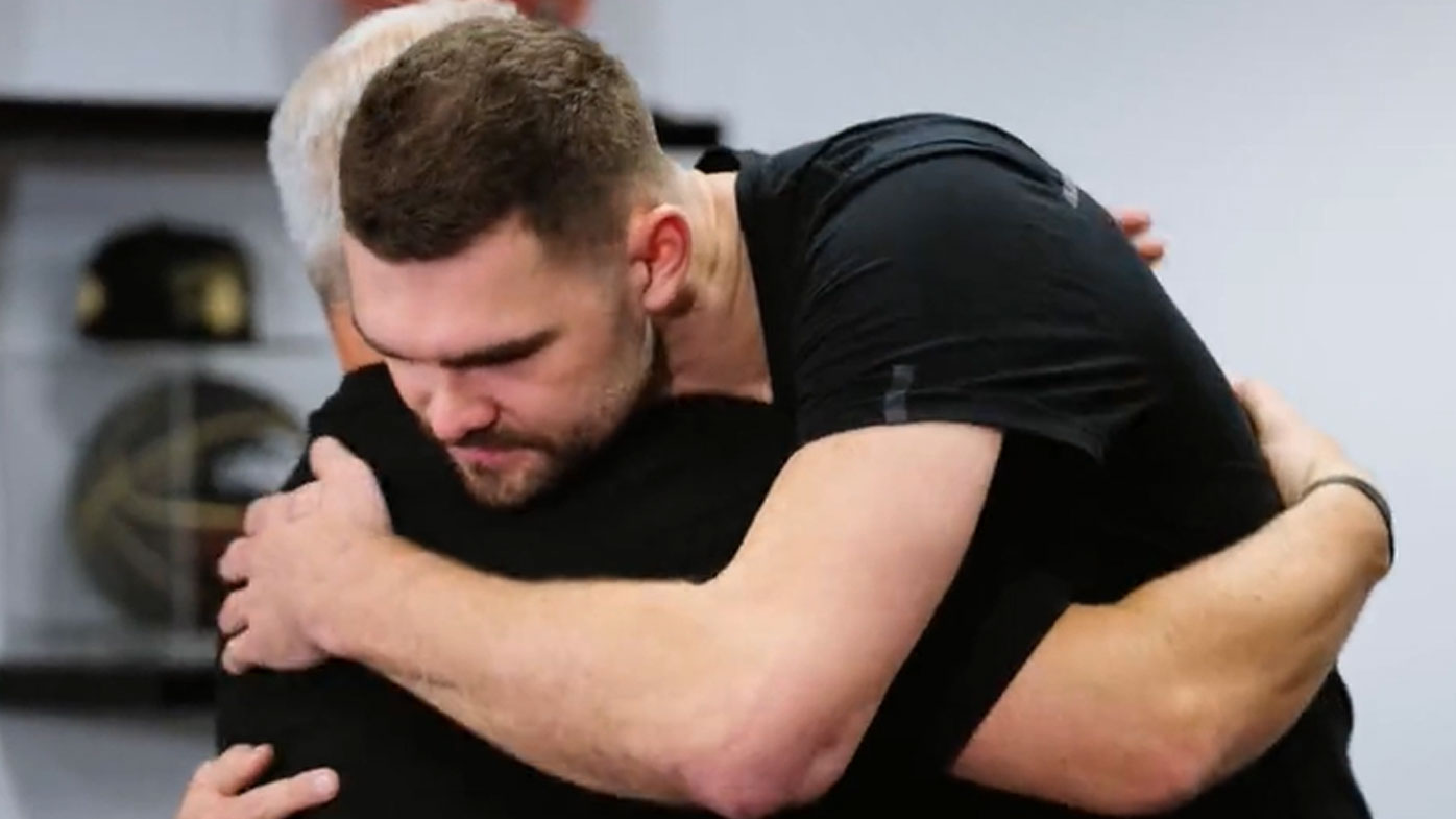 Isaac Humphries shares an embrace with Melbourne United coach Dean Vickerman