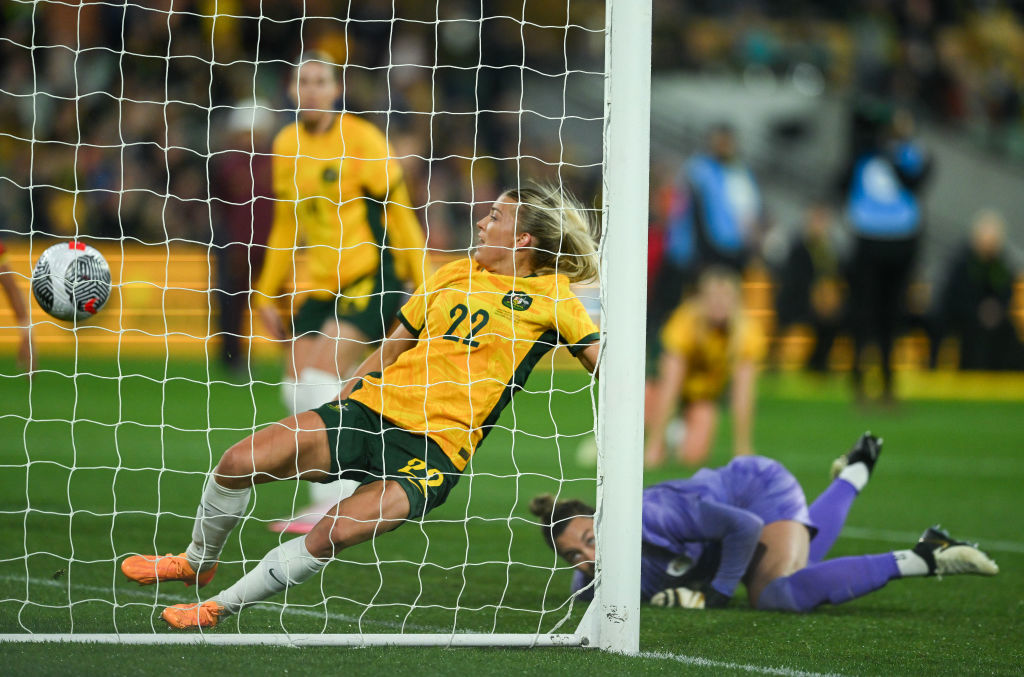 Charlotte Grant attempts to stop China PR first goal.