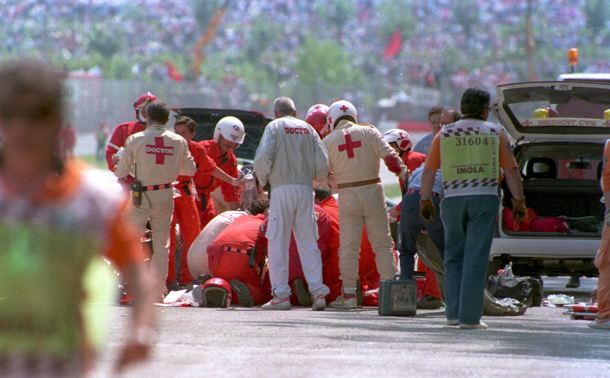 Ayrton Senna being attended to by medics after his crash while leading the 1994 San Marino Grand Prix.  Mandatory Credit: Anton Want/ALLSPORT