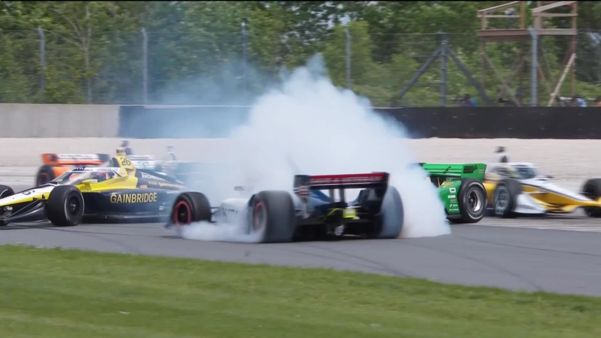 Linus Lundqvist (middle), Colton Herta (left), and Marcus Armstrong (right) spin on lap one of the Grand Prix of Road America.