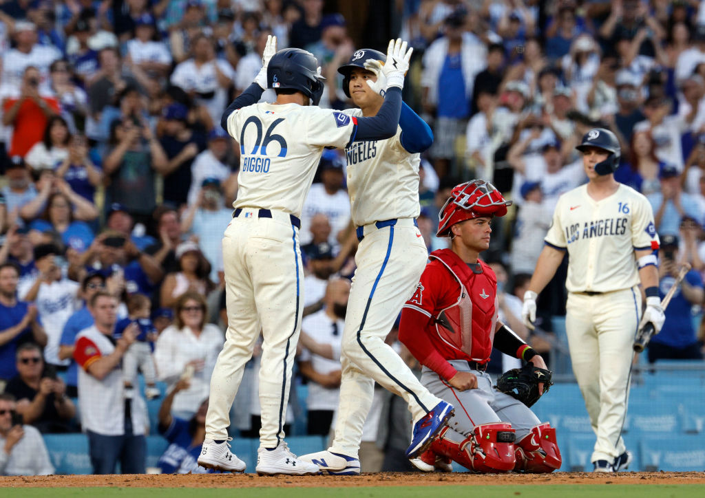 Shohei Ohtani celebrates with Cavan Biggio (left) after hitting a two run homer run.