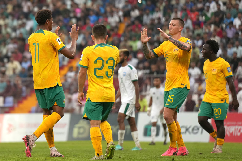 Kusini Yengi of Australia (L) celebrates scoring his side's second goal.