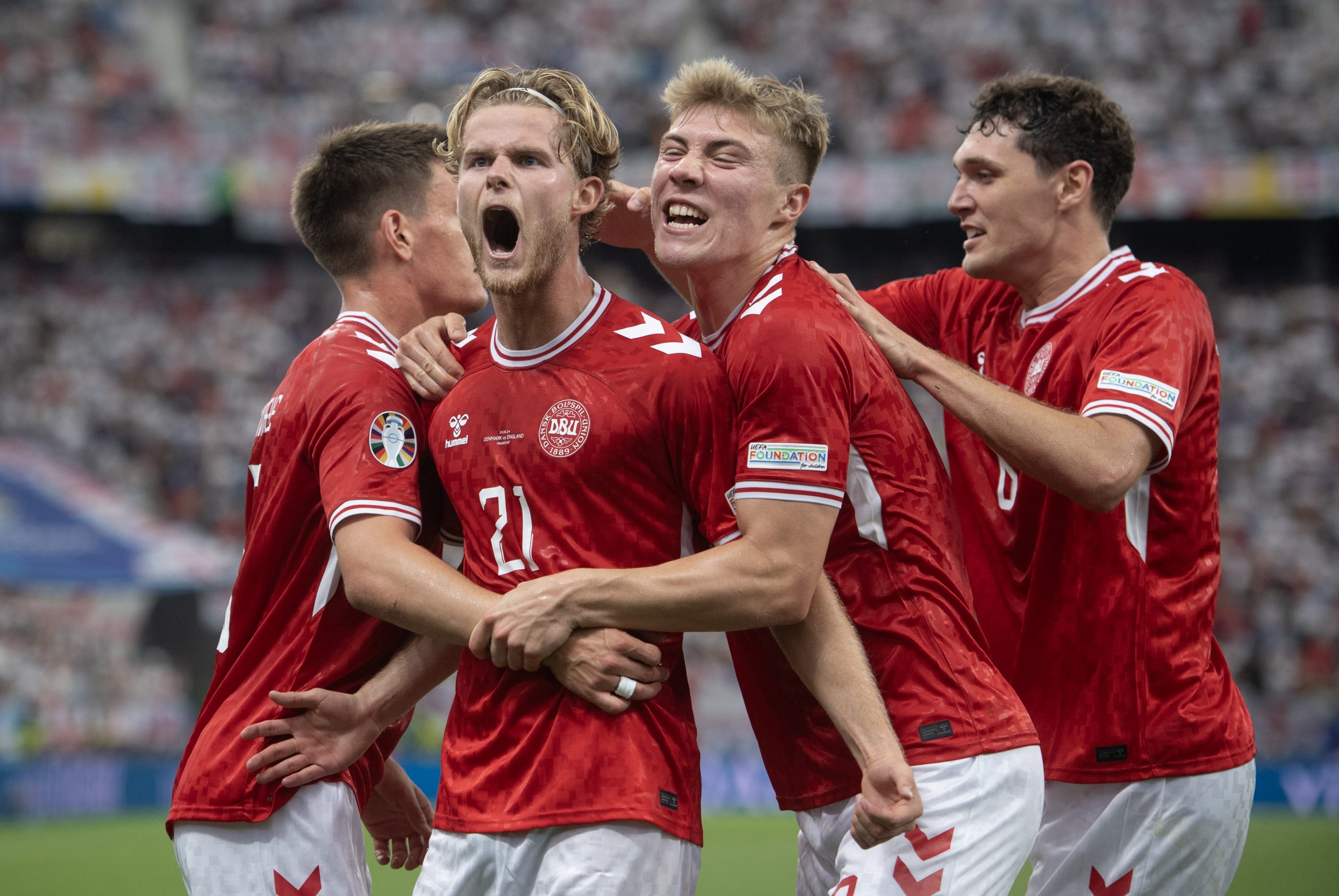 Morten Hjulmand of Denmark celebrates scoring his team's goal with team mates Rasmus Hojlund, Joakim Maehle and Andreas Christensen during the UEFA EURO 2024 group stage match between Denmark and England at Frankfurt Arena on June 20, 2024 in Frankfurt am Main, Germany. (Photo by Joe Prior/Visionhaus via Getty Images)