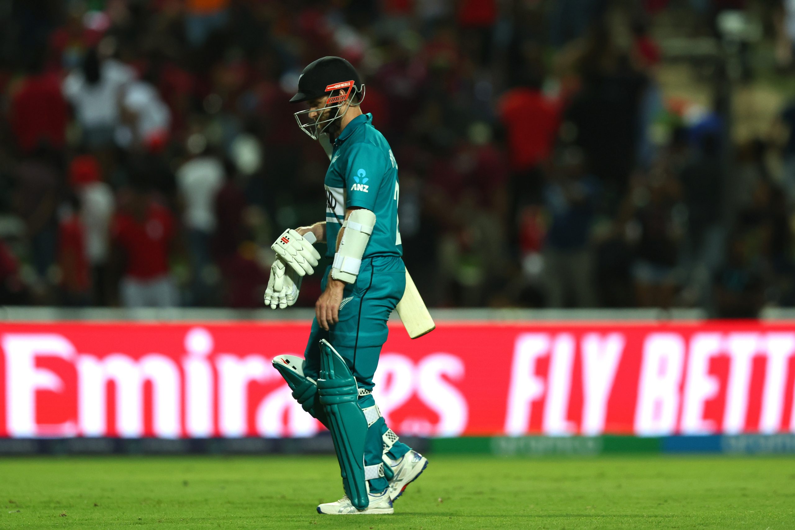 Kane Williamson of New Zealand leaves the field after being dismissed.