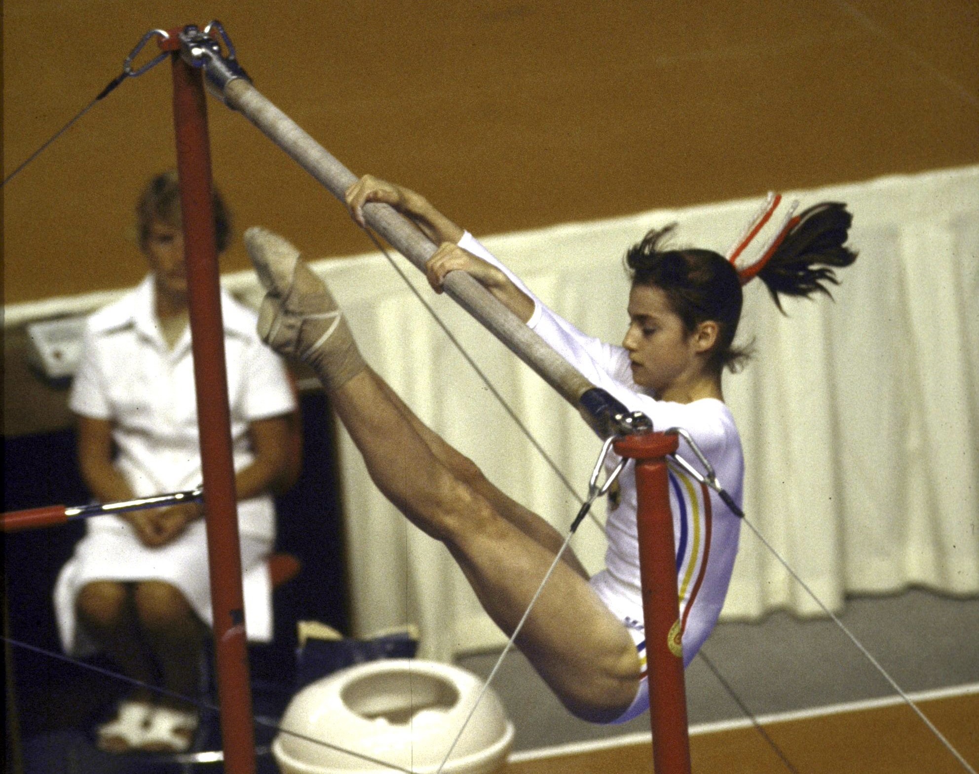 Nadia Comanecia of Romania competing at the Montreal 1976 Olympics, where she became the first gymnast in Olympic history to score a perfect 10.