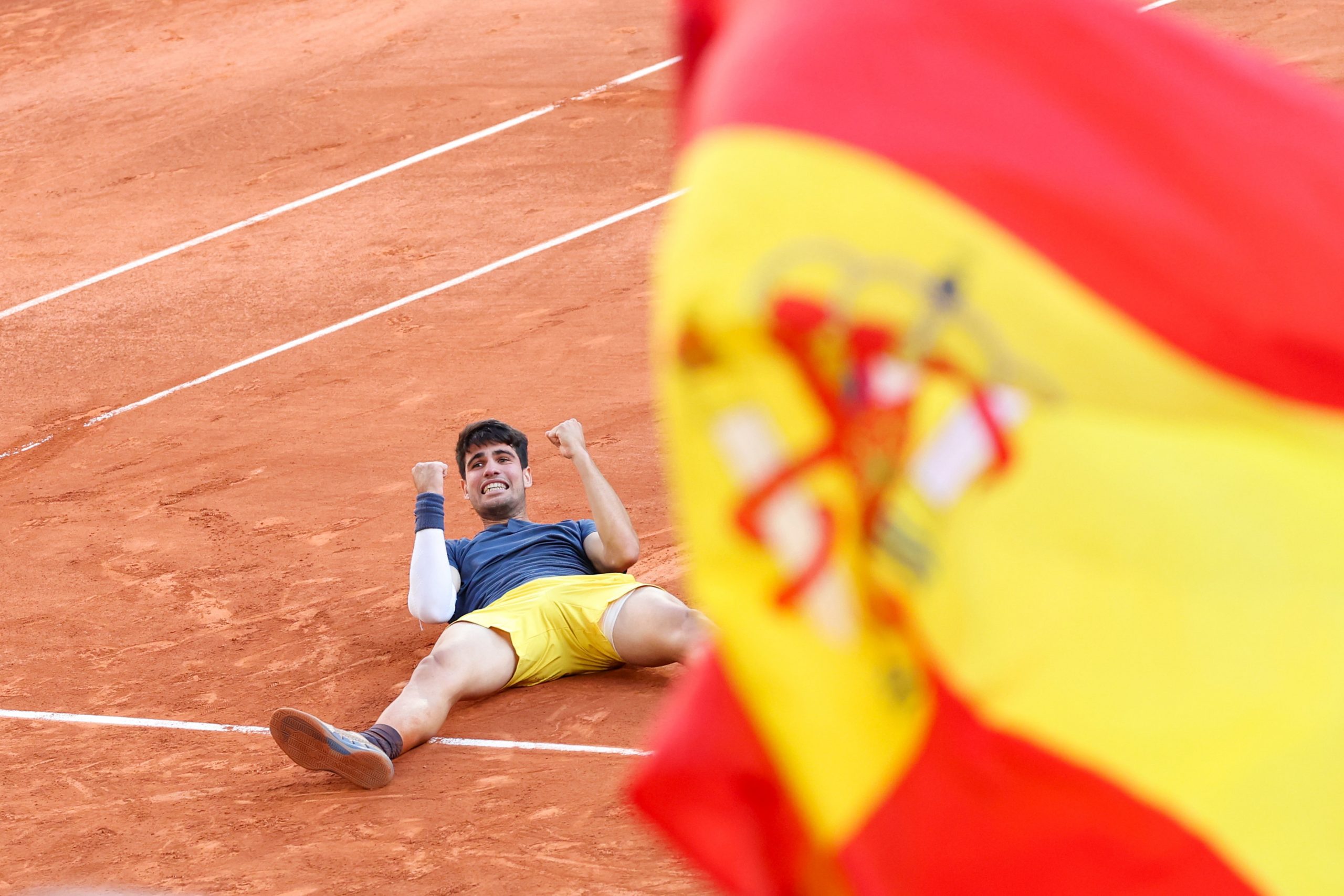 Carlos Alcaraz of Spain reacts after winning the Men's Singles Final against Alexander Zverev of Germany at Roland Garros on June 09, 2024 in Paris, France. (Photo by Stephane Cardinale - Corbis/Corbis via Getty Images)