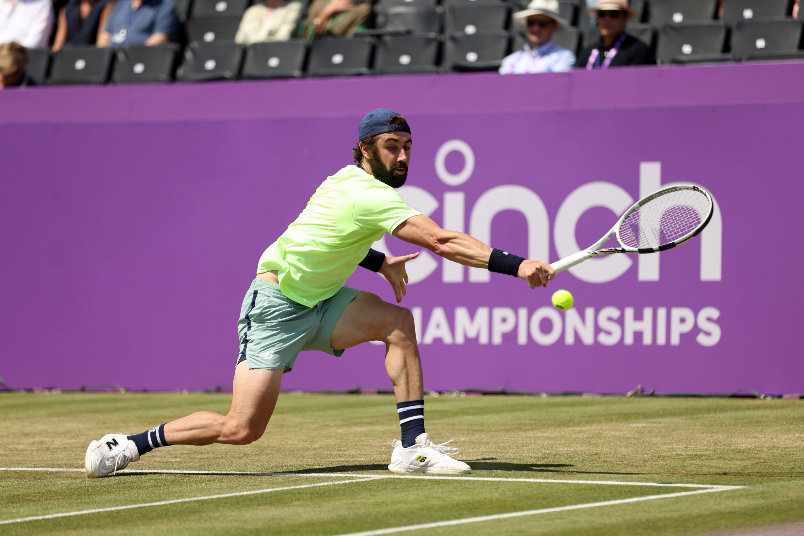 Jordan Thompson of Australia plays a backhand against Taylor Fritz of United States during the Men's Singles Quarter Final match on Day Five of the cinch Championships at The Queen's Club on June 21, 2024 in London, England.  (Photo by Luke Walker/Getty Images for LTA)