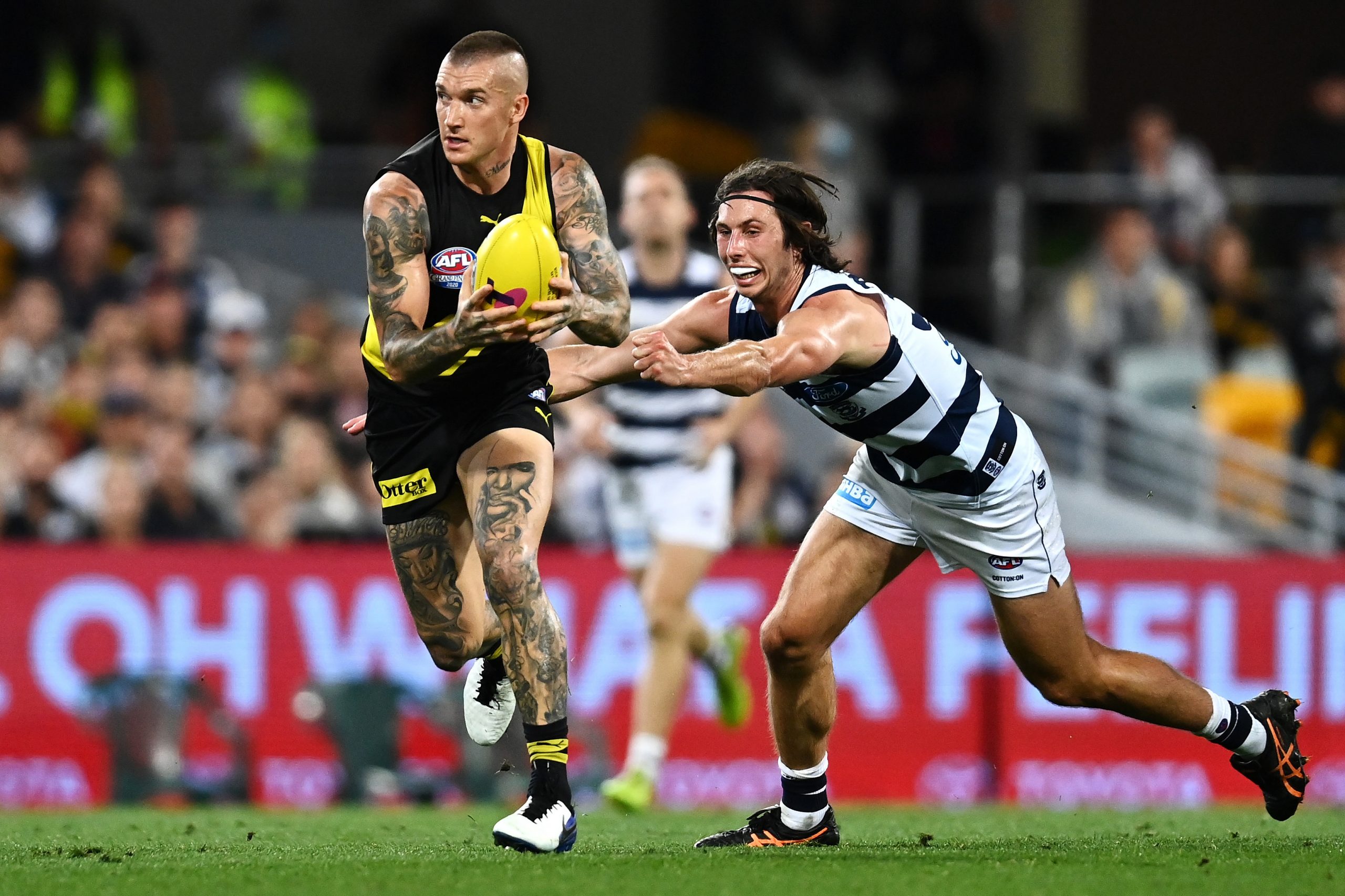 Dustin Martin of the Tigers runs the ball during the 2020 AFL Grand Final match between the Richmond Tigers and the Geelong Cats at The Gabba on October 24, 2020 in Brisbane, Australia. (Photo by Quinn Rooney/Getty Images)