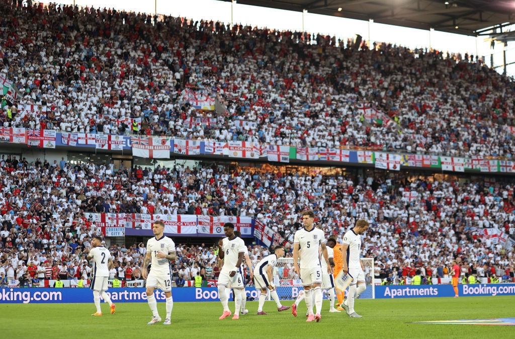 England walk out onto the field.