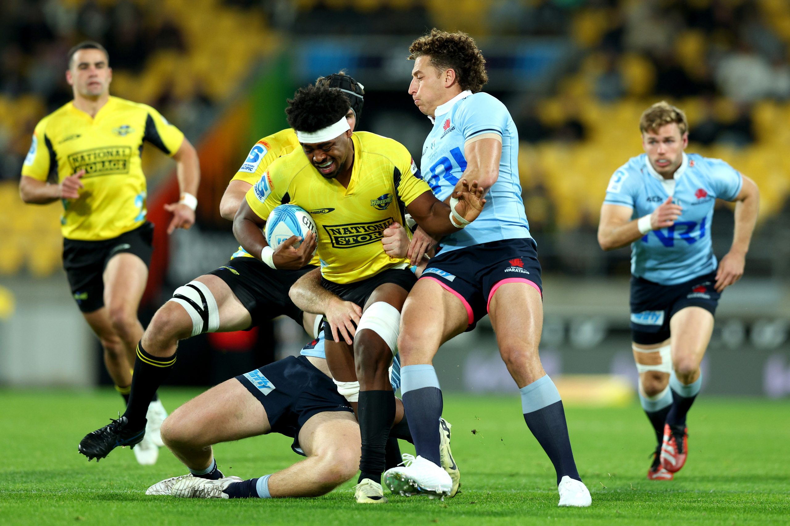 Peter Lakai of the Hurricanes is tackled during the round 11 Super Rugby Pacific match between Hurricanes and NSW Waratahs.