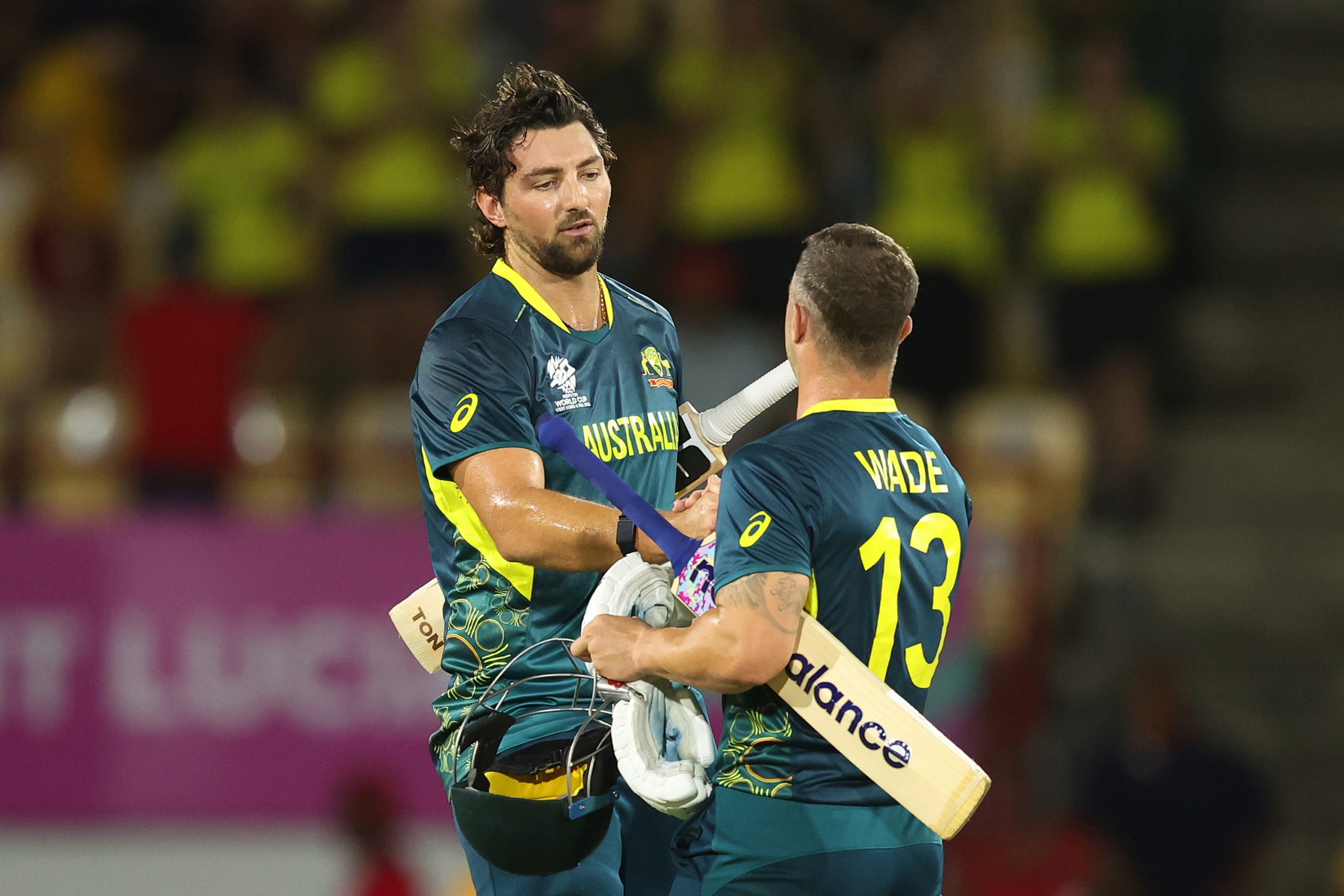 Tim David and Matthew Wade shake hands after securing victory in the ICC Men's T20 Cricket World Cup West Indies & USA 2024 match between Australia and Scotland at  Daren Sammy National Cricket Stadium on June 15, 2024 in Gros Islet, Saint Lucia. (Photo by Robert Cianflone/Getty Images)