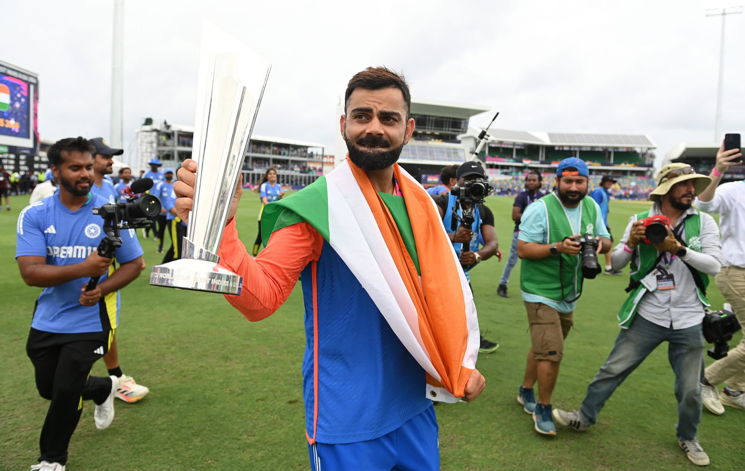 Virat Kohli holds the trophy during a lap of honour after India won the ICC Men's T20 Cricket World Cup West Indies & USA 2024 Final match between South Africa and India at Kensington Oval on June 29, 2024 in Bridgetown, Barbados. (Photo by Philip Brown/Getty Images)