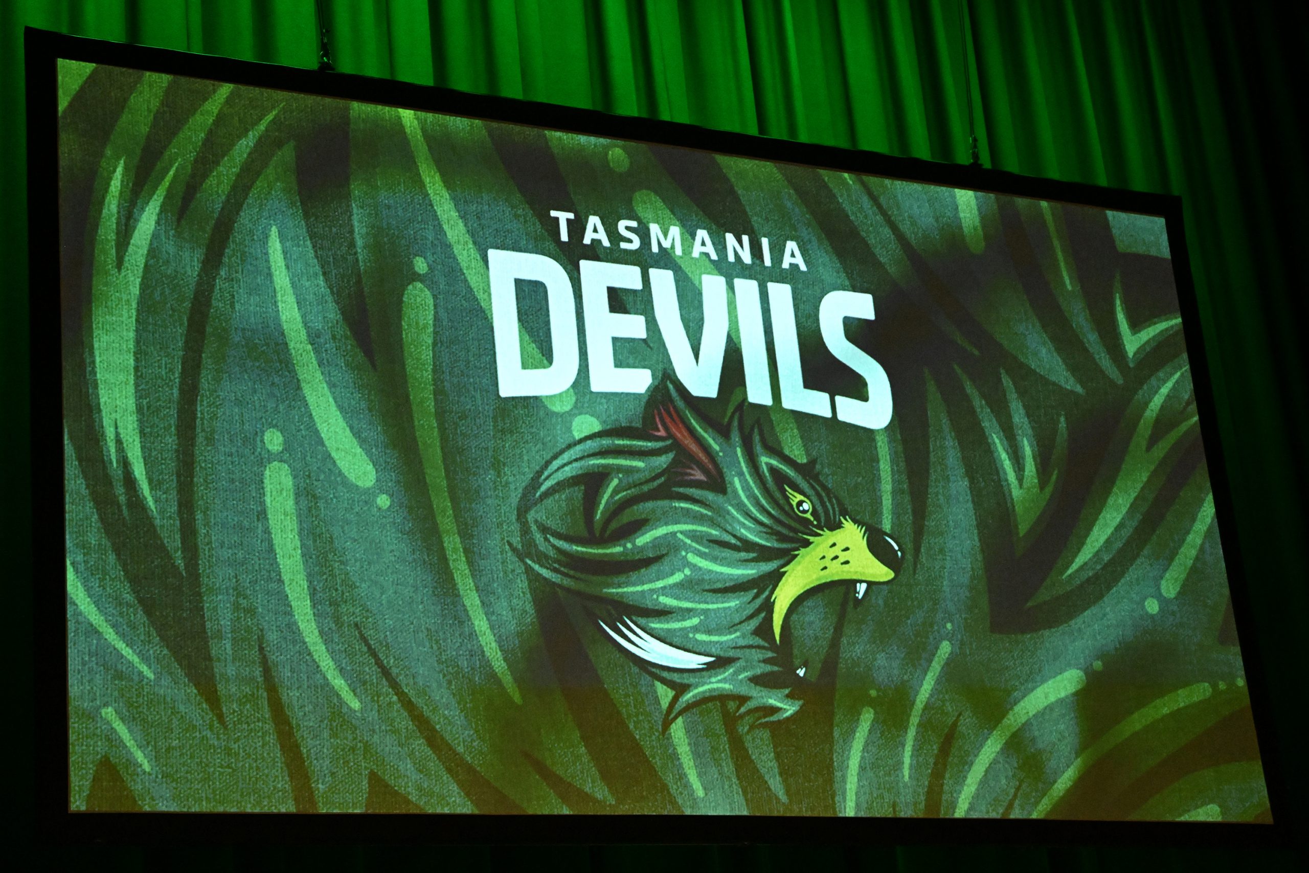 The Tasmania Devils logo is unveiled during an AFL event.