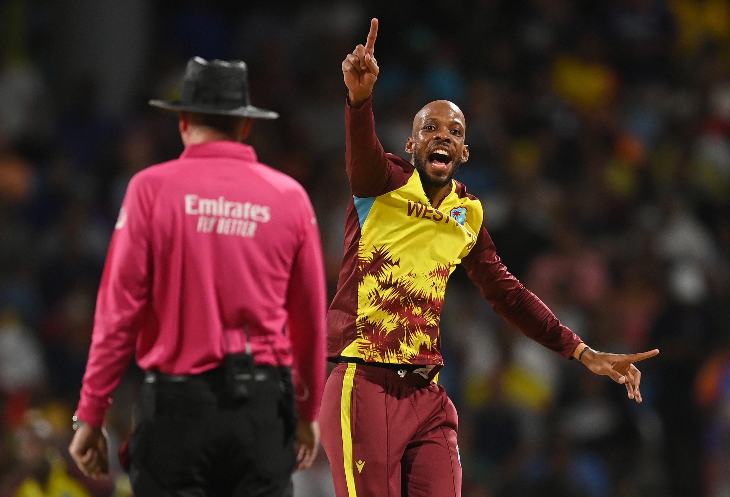 Roston Chase of West Indies dismisses Corey Anderson lbw.